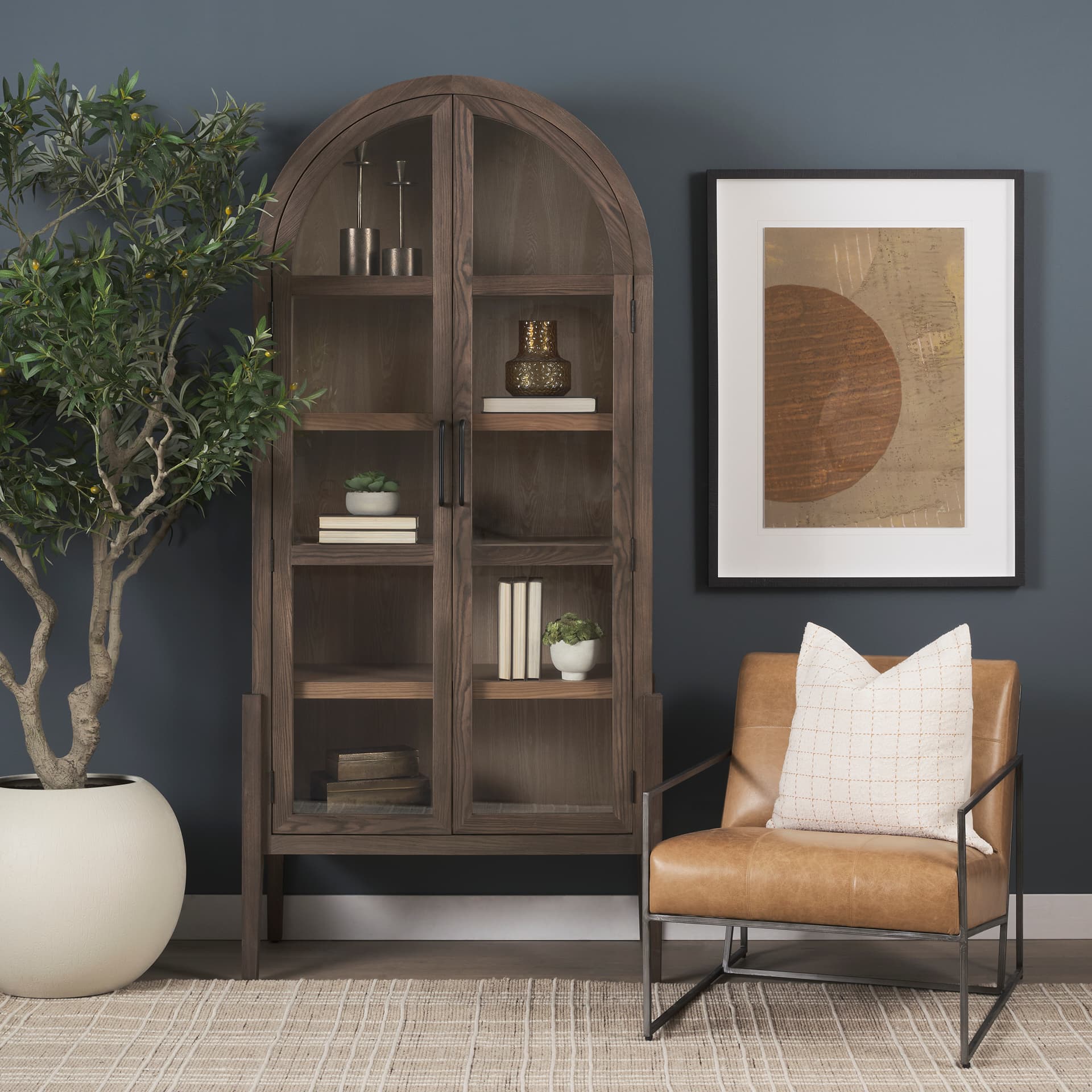 Stratton Gunmetal w/ Genuine Brown Leather Upholstered Accent Chair — in a styled room