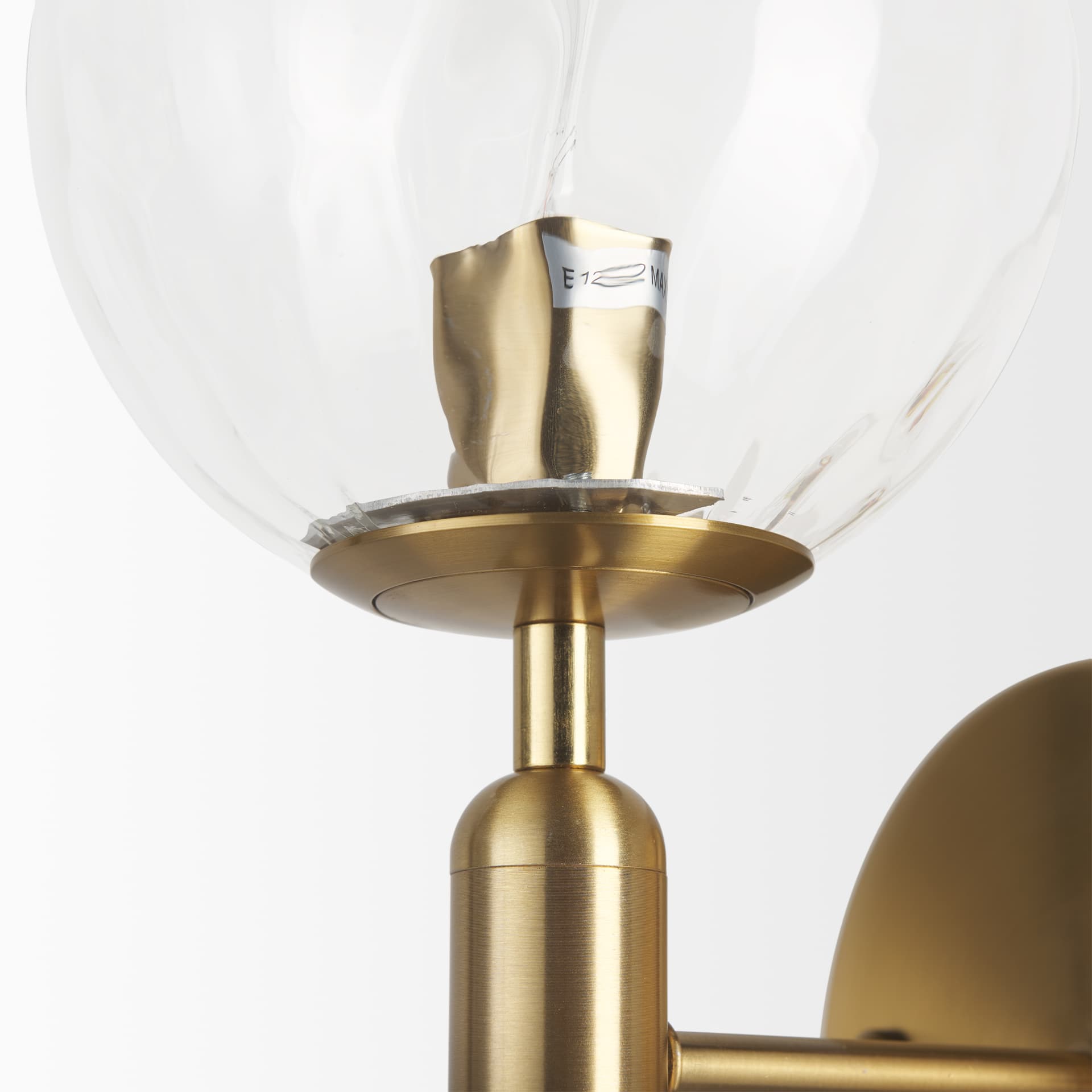Britton Gold Metal w/ Clear Glass Globe 1-Light Wall Sconce — product photograph