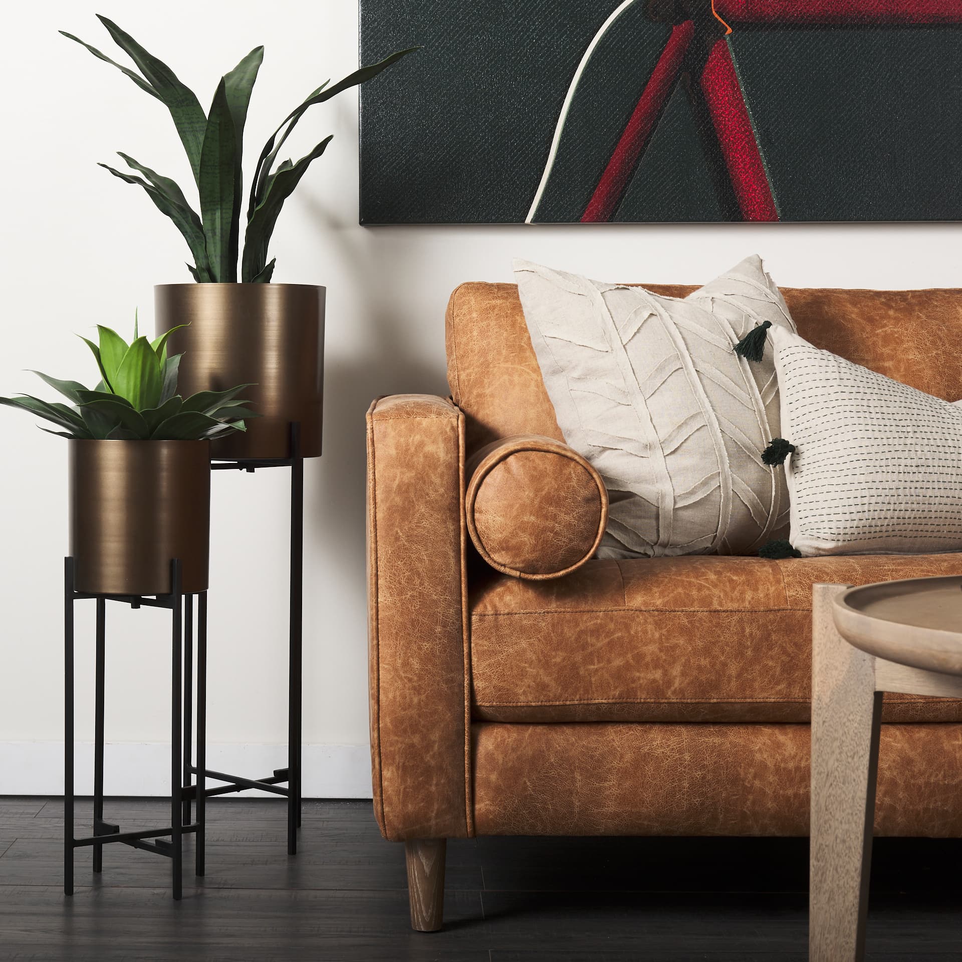 Loretta 88.0L x 36.2W x 33.9H Cognac Brown Faux Leather Three Seater Sofa with Two Bolster Cushions — product photograph