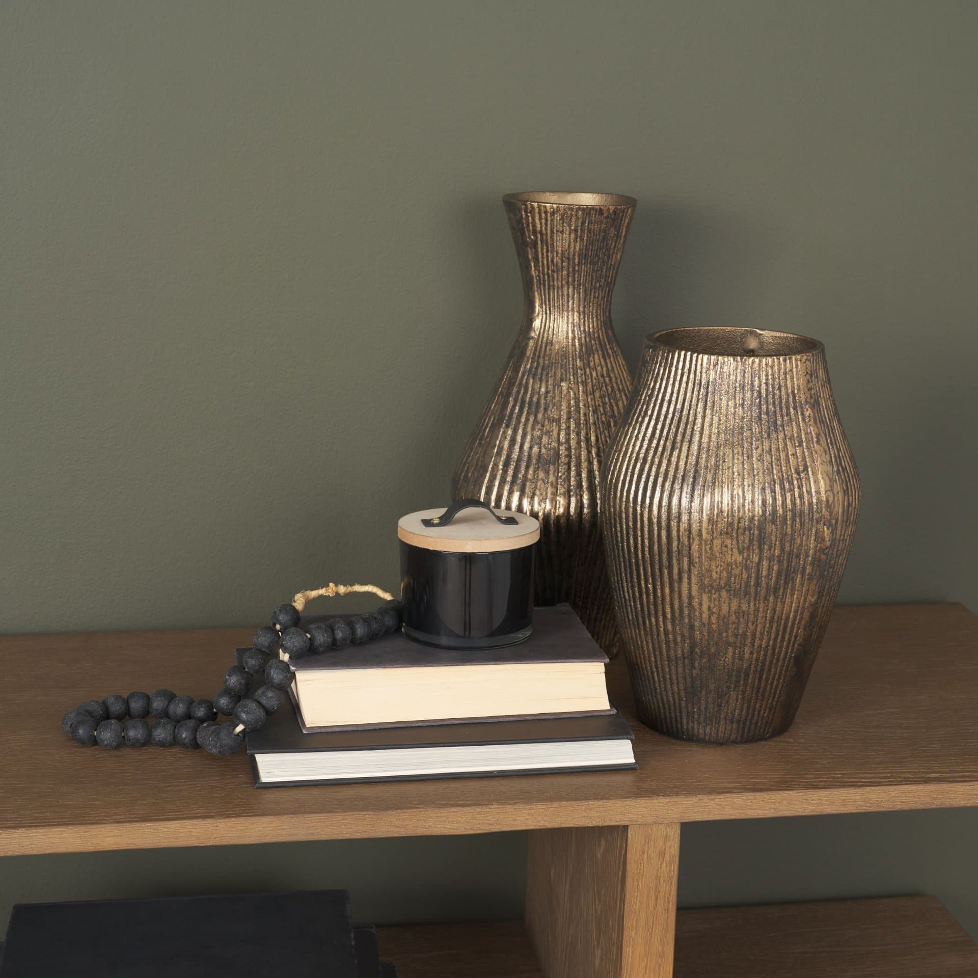 Patine Wide Antiqued Brass Metal Fluted Decorative Vase — in a styled room
