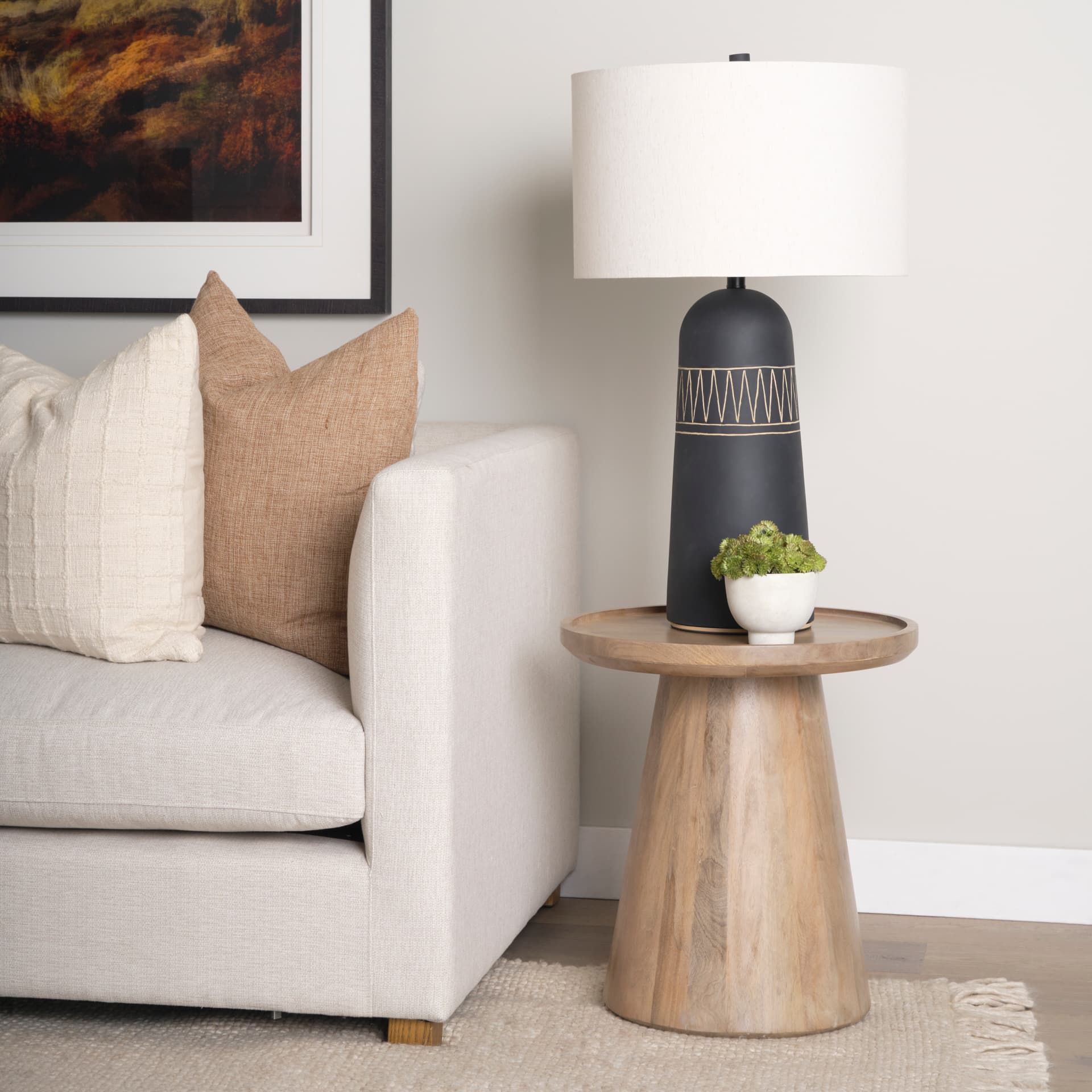 Takoda Light Brown Wood Tapered Drum Accent Table — in a styled room