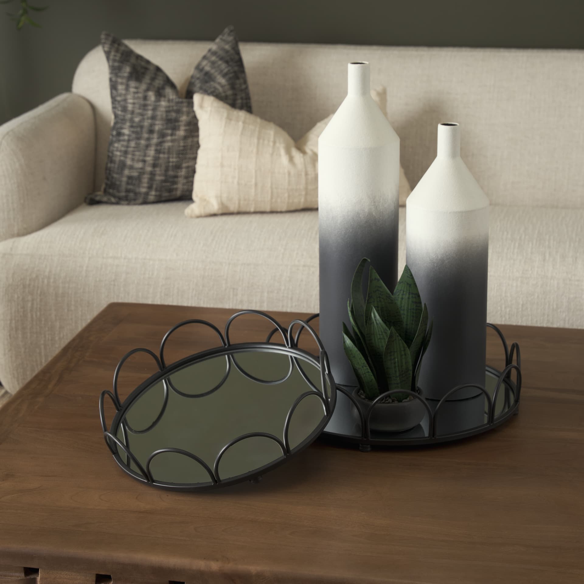 Lenore Round Metal/Mirror Tray Black (Set of 2) — in a styled room