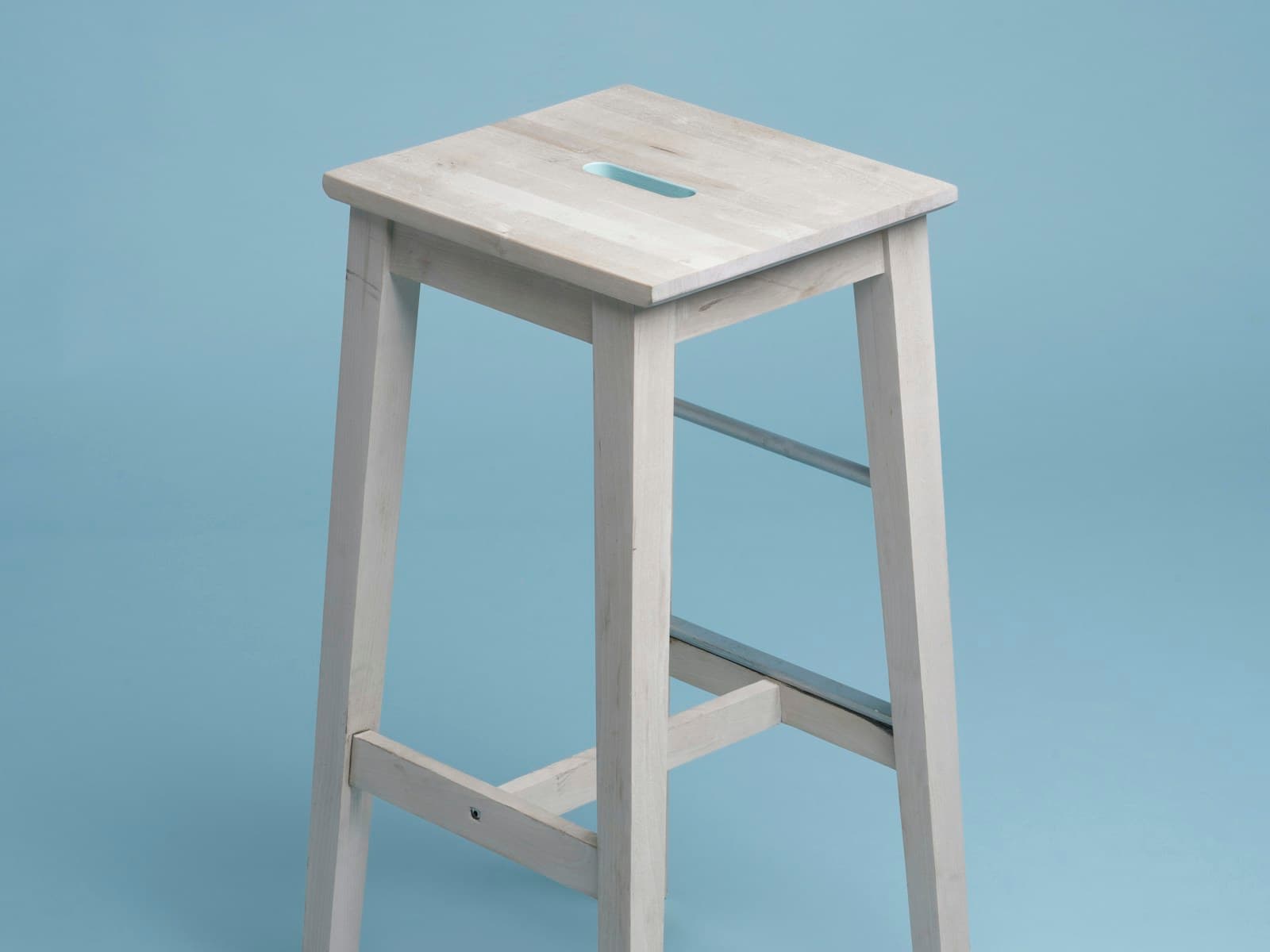 Cormier spindle dining chair in natural ash, three-quarter view