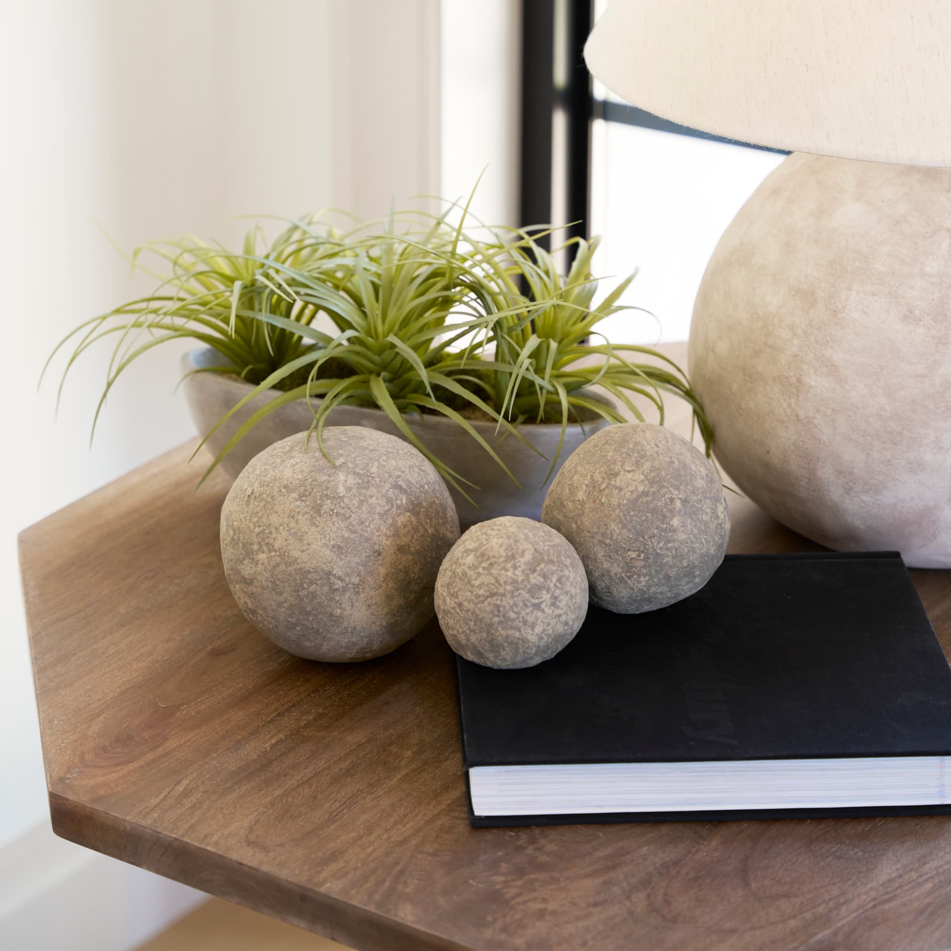 Sunita Set of 3 Gray Paper Mache Orbs — in a styled room