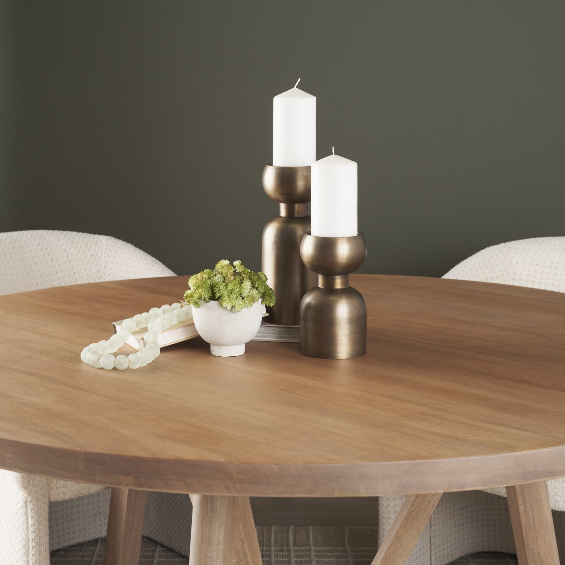 Pelar Small Antiqued Brass Stacked Pillar Candle Holder — in a styled room