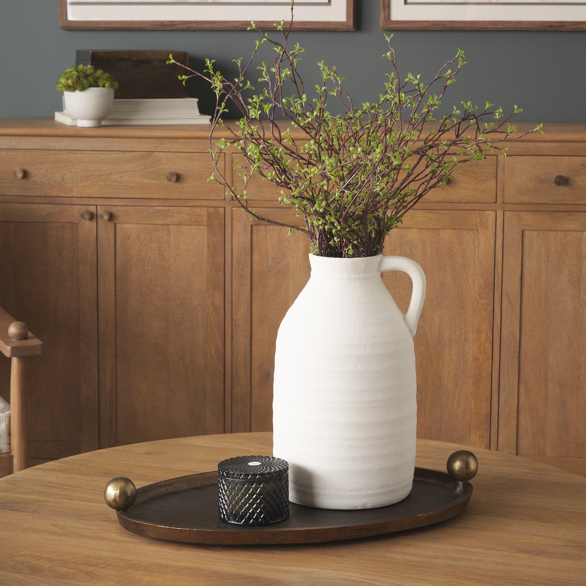 Jianna Small Oval Textured Antiqued Gold Metal Tray with Handles — in a styled room