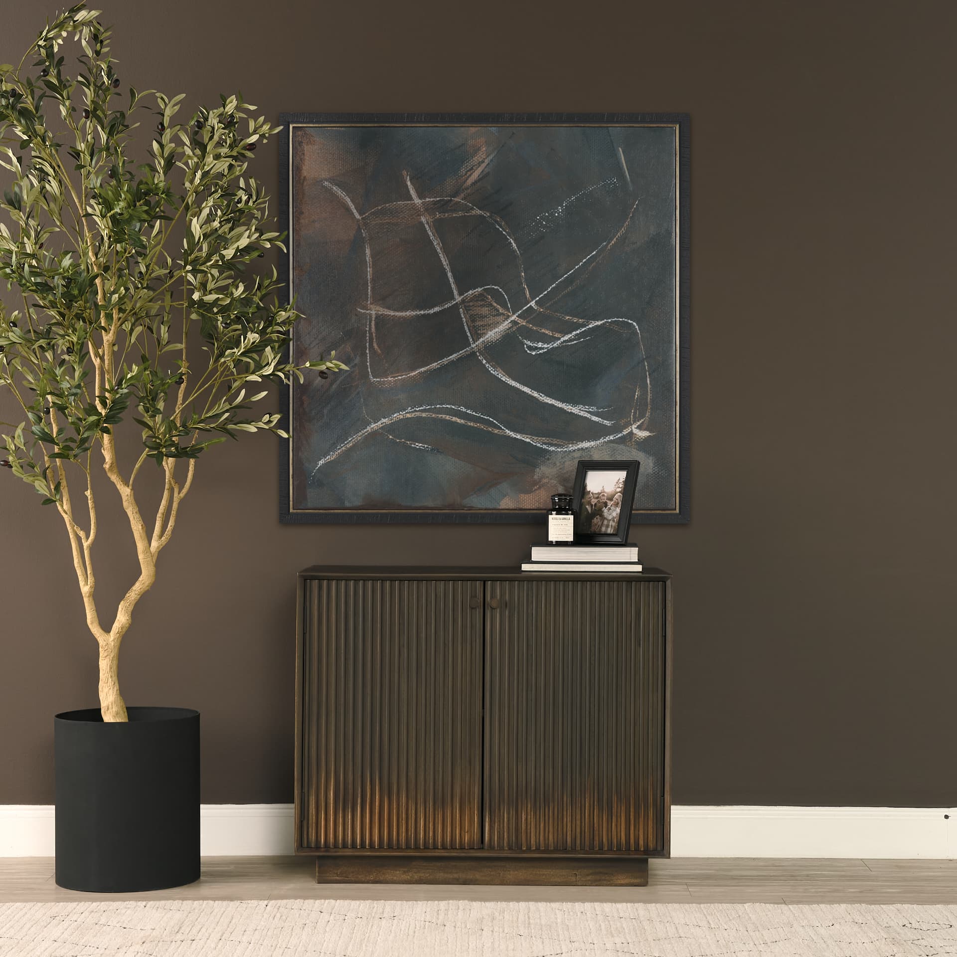 Cinder Distressed Dark Brown Wood Reeded 2-Door Closed Accent Cabinet — in a styled room