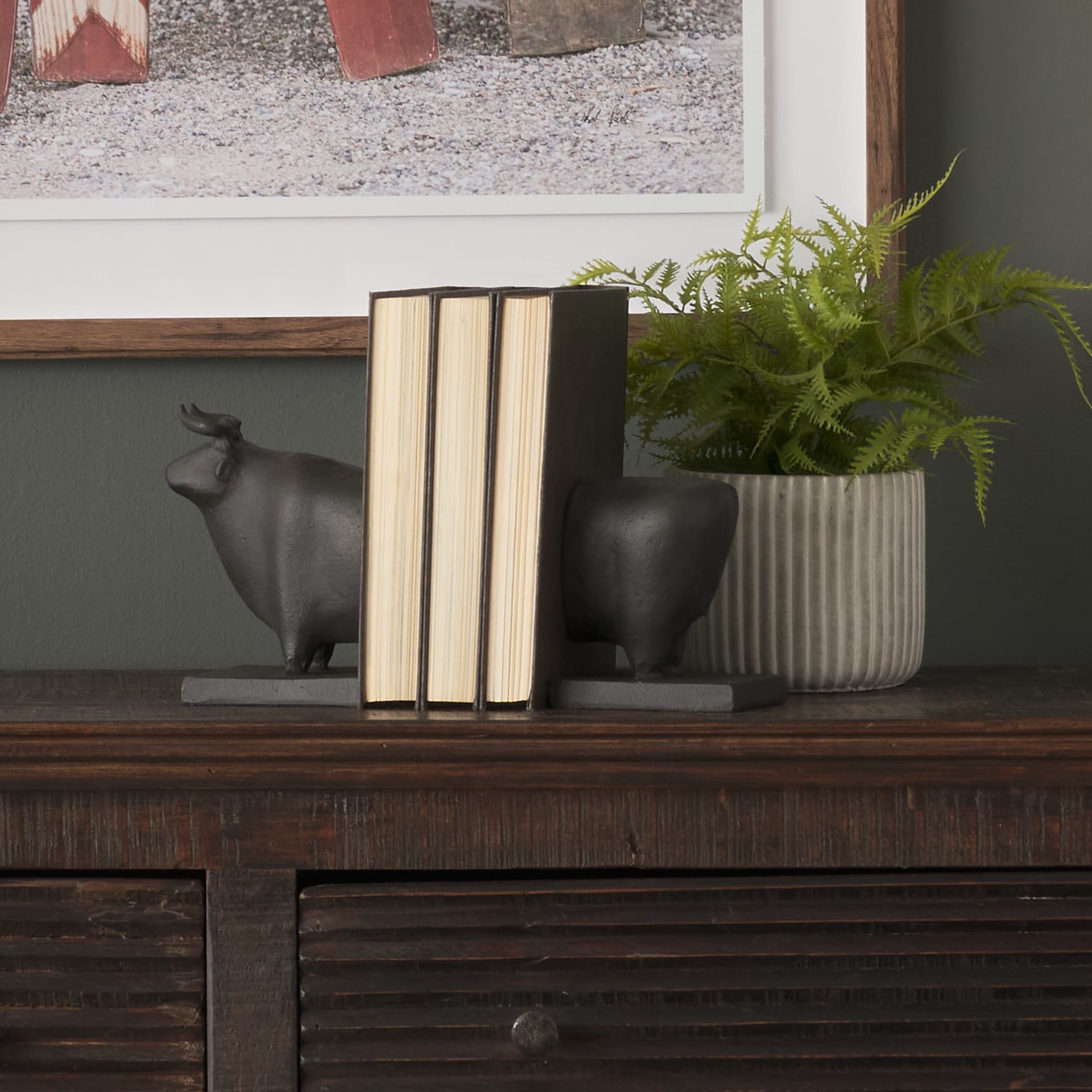 Taurus III (Set of 2) 9L x 4W Black Cast Aluminum Bull Bookends — in a styled room