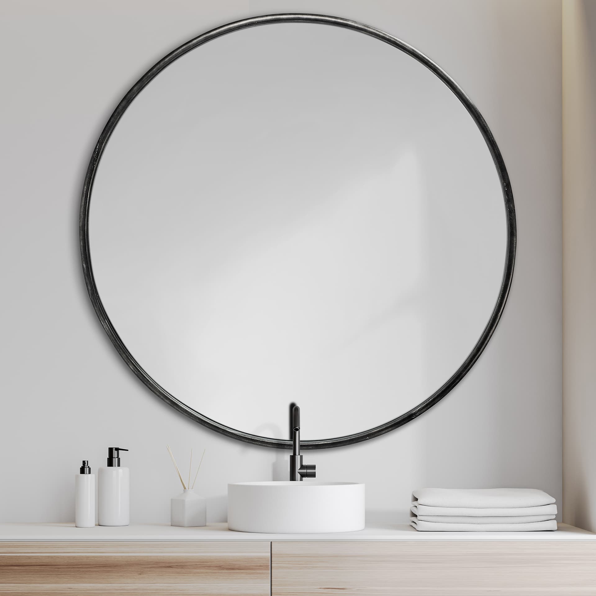 Piper 47.2L x 1.0W x 47.2H Large Black Metal Round Wall Mirror — in a styled room