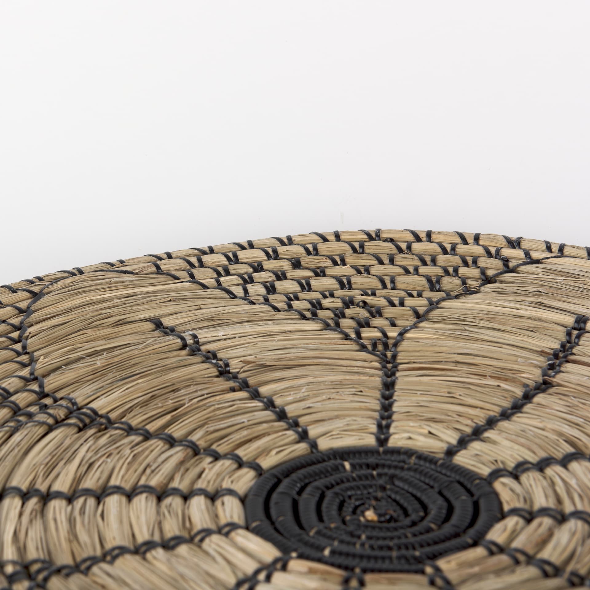 Mekhi 24.0L x 24.0W x 3.5 Light Brown Seagrass W/Black String Round Wall Hanging Plate — product photograph