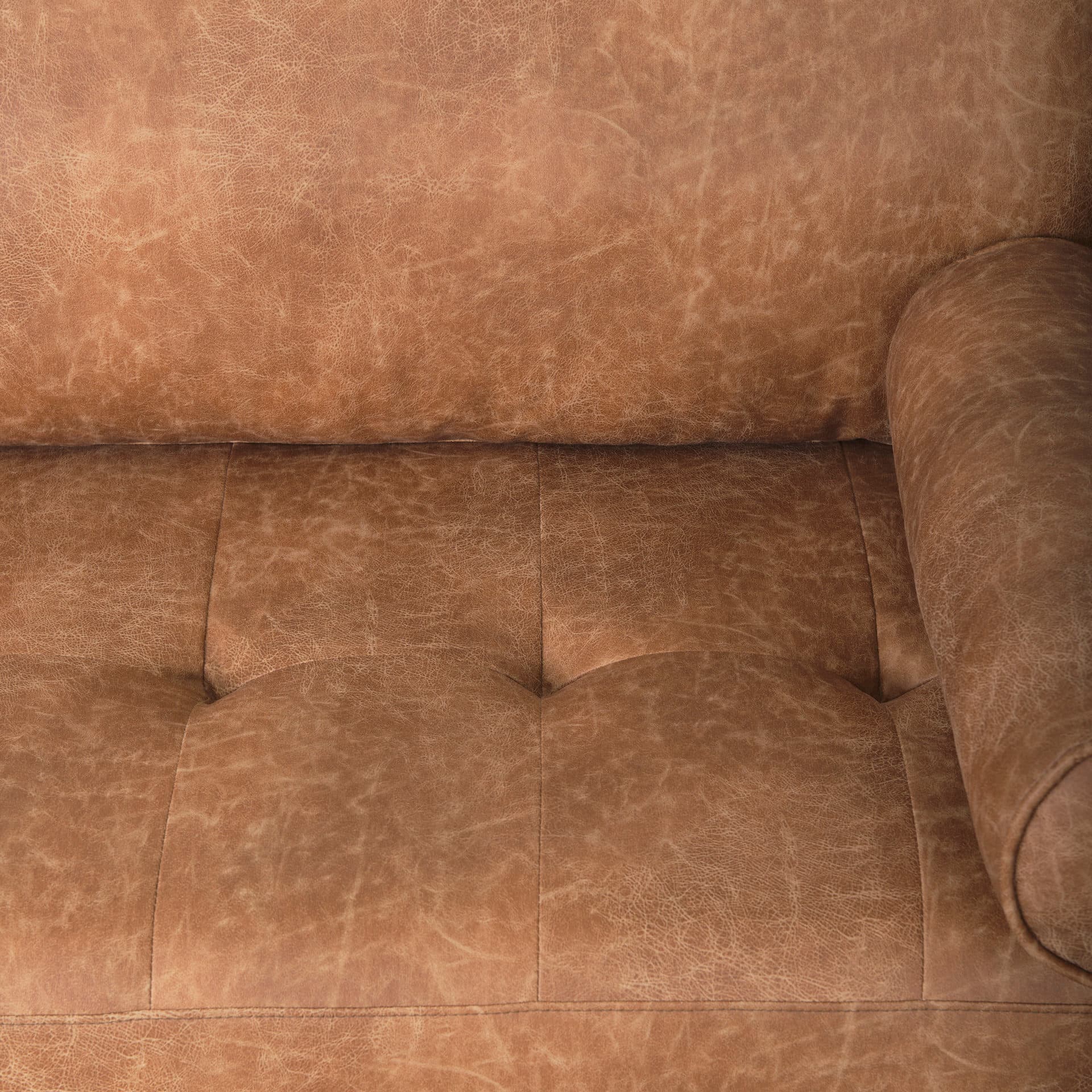 Loretta 88.0L x 36.2W x 33.9H Cognac Brown Faux Leather Three Seater Sofa with Two Bolster Cushions — product photograph