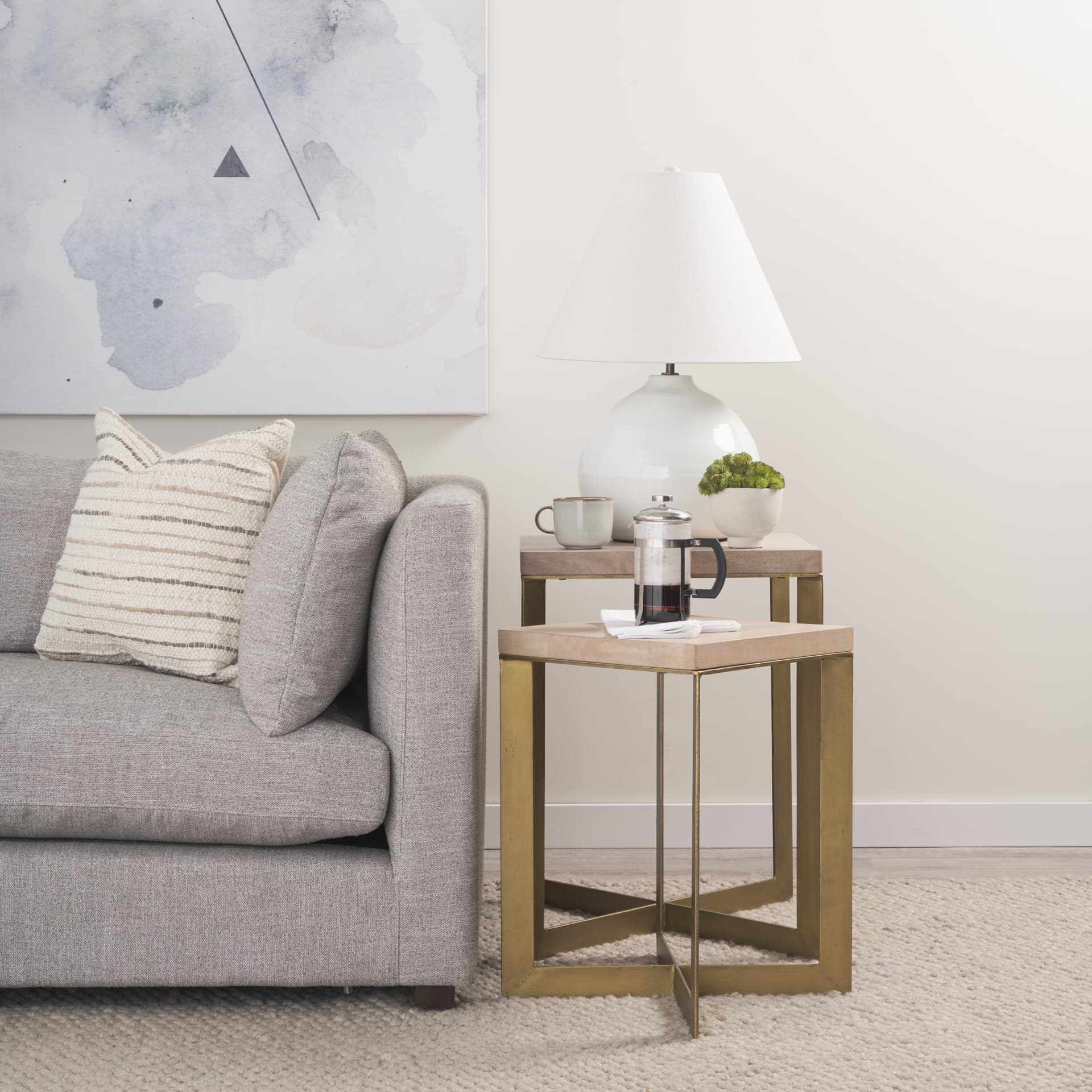 Mehdi White Ceramic Table Lamp — in a styled room