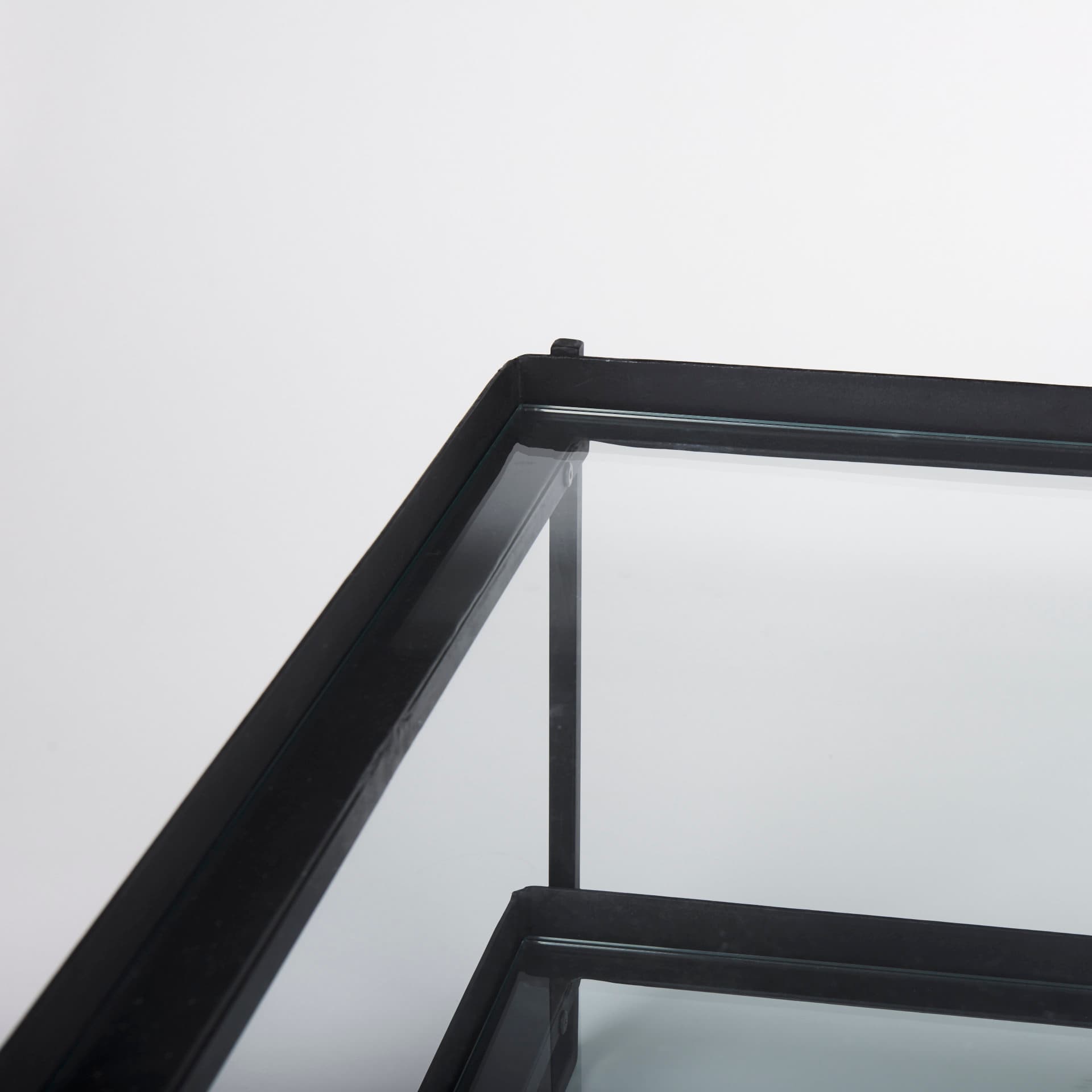 Trey 56"L x 32"W x 17"H Black Metal W/Glass Coffee Table — product photograph