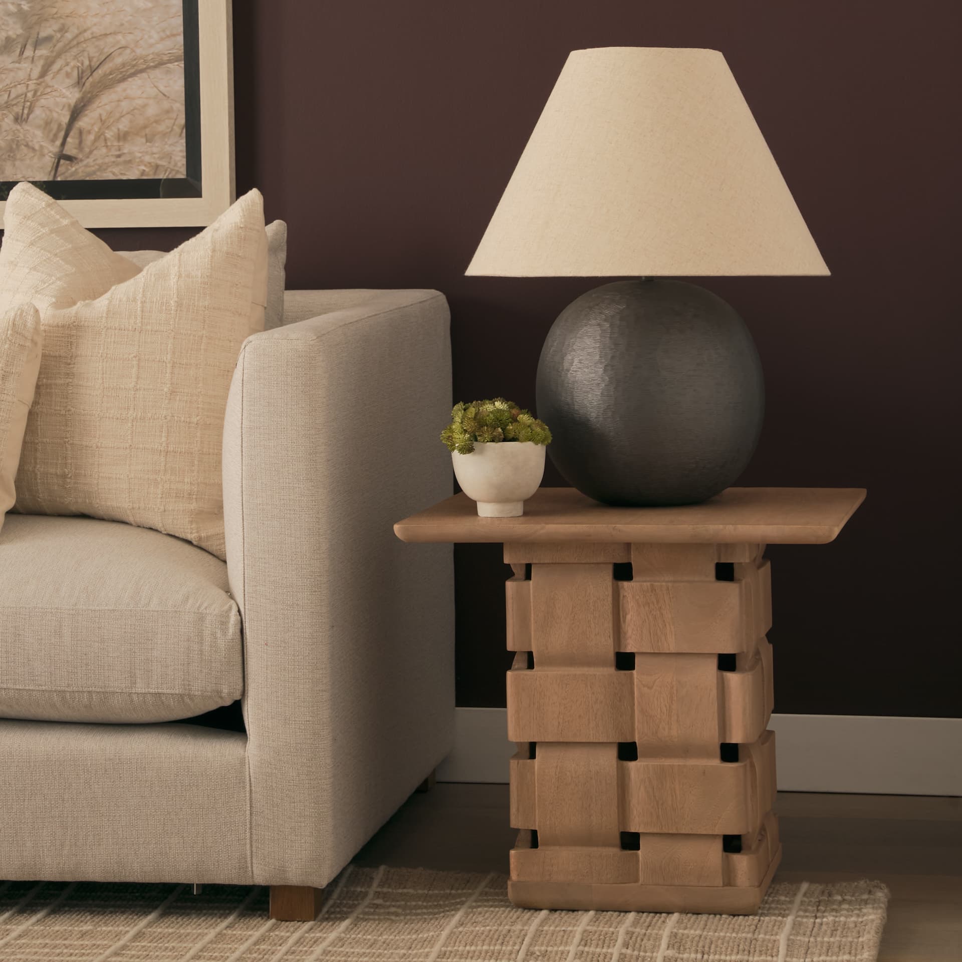 Trellyn Light Brown Wood w/ Carved Woven Base Square Accent Table — in a styled room