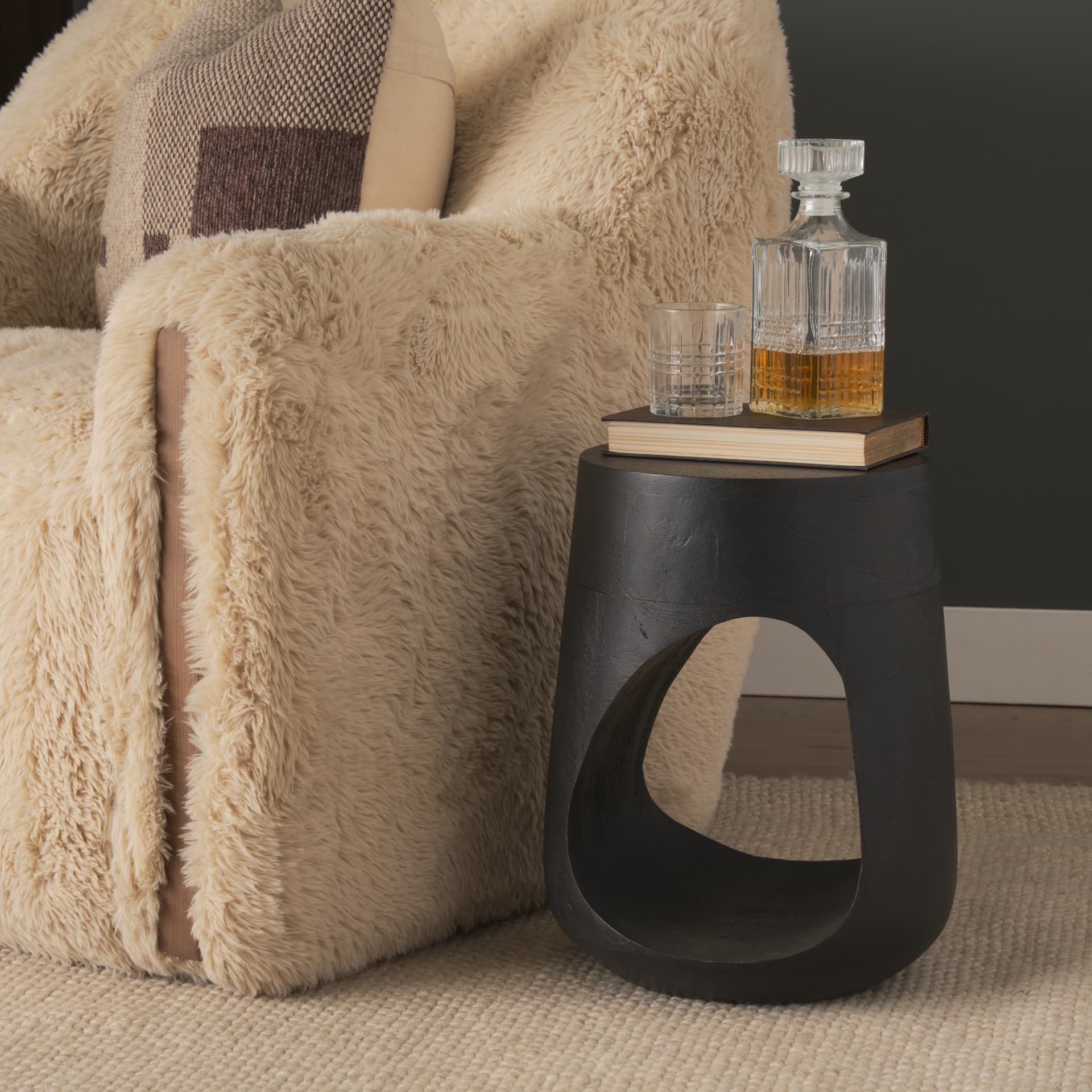 Cove Dark Brown Sculptural Open Side Table — in a styled room