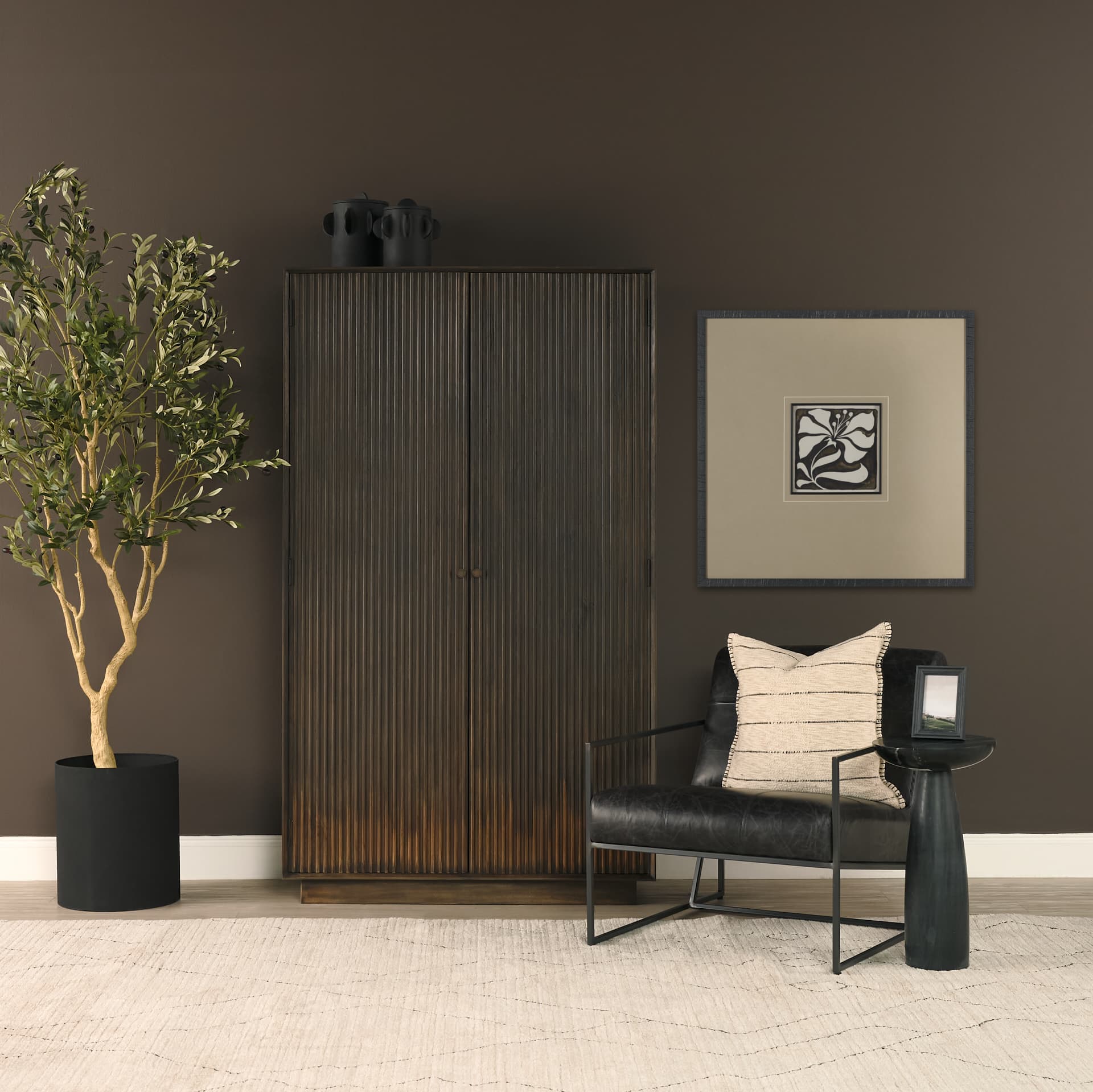 Cinder Distressed Dark Brown Wood Reeded 2-Door Closed Tall Cabinet — in a styled room