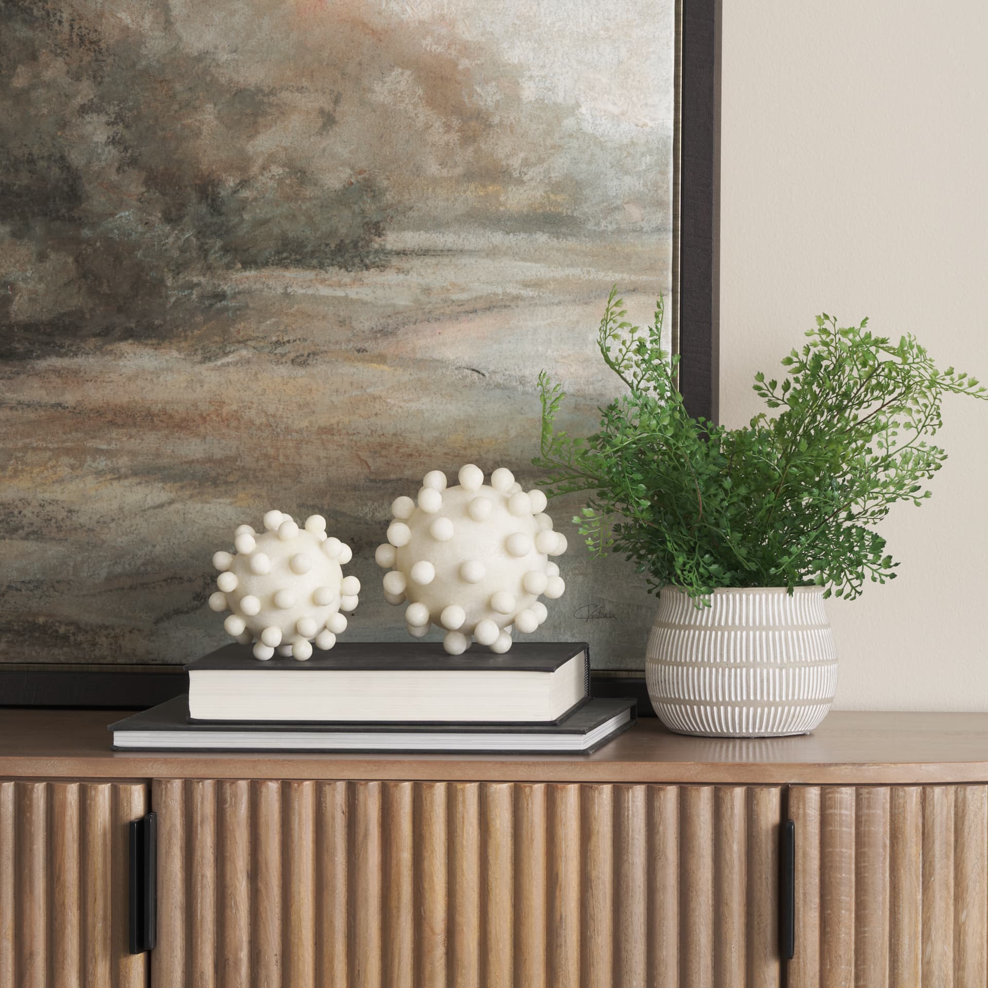 Malo 4.7L x 4.7W x 4.7H Cream Resin Small Sphere Decorative Object — in a styled room