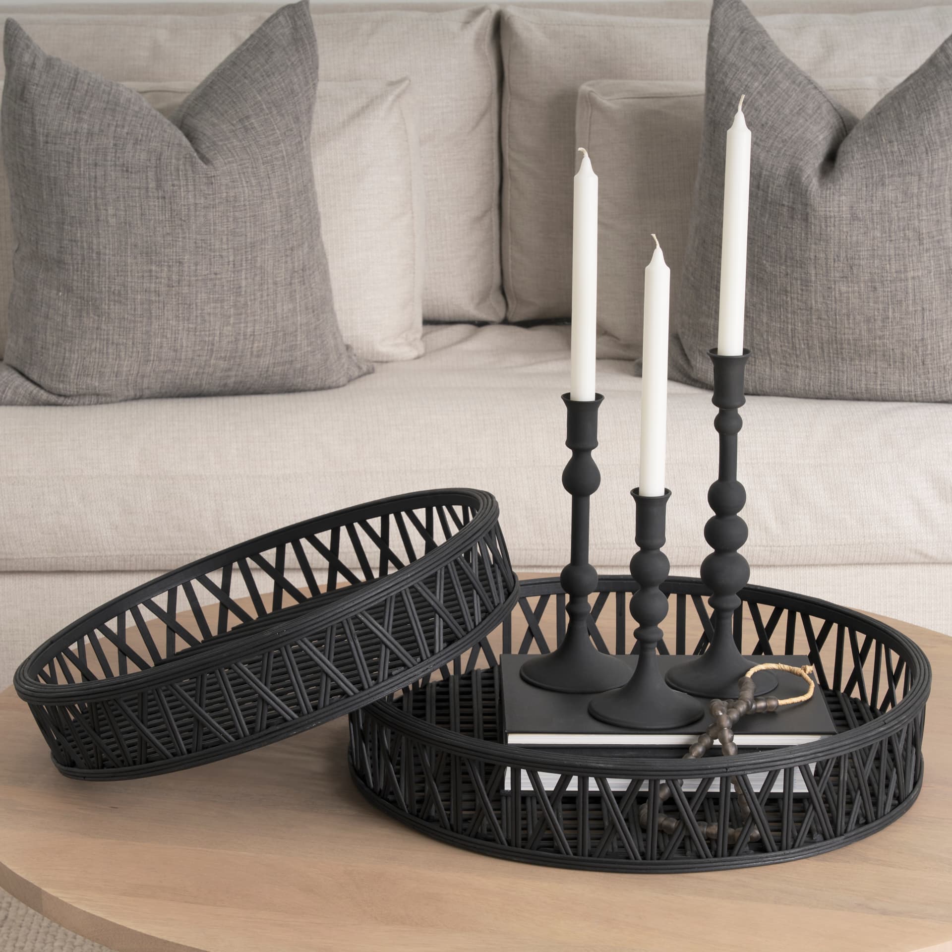Thea Matte Black Wicker Trays (Set of 2) — in a styled room