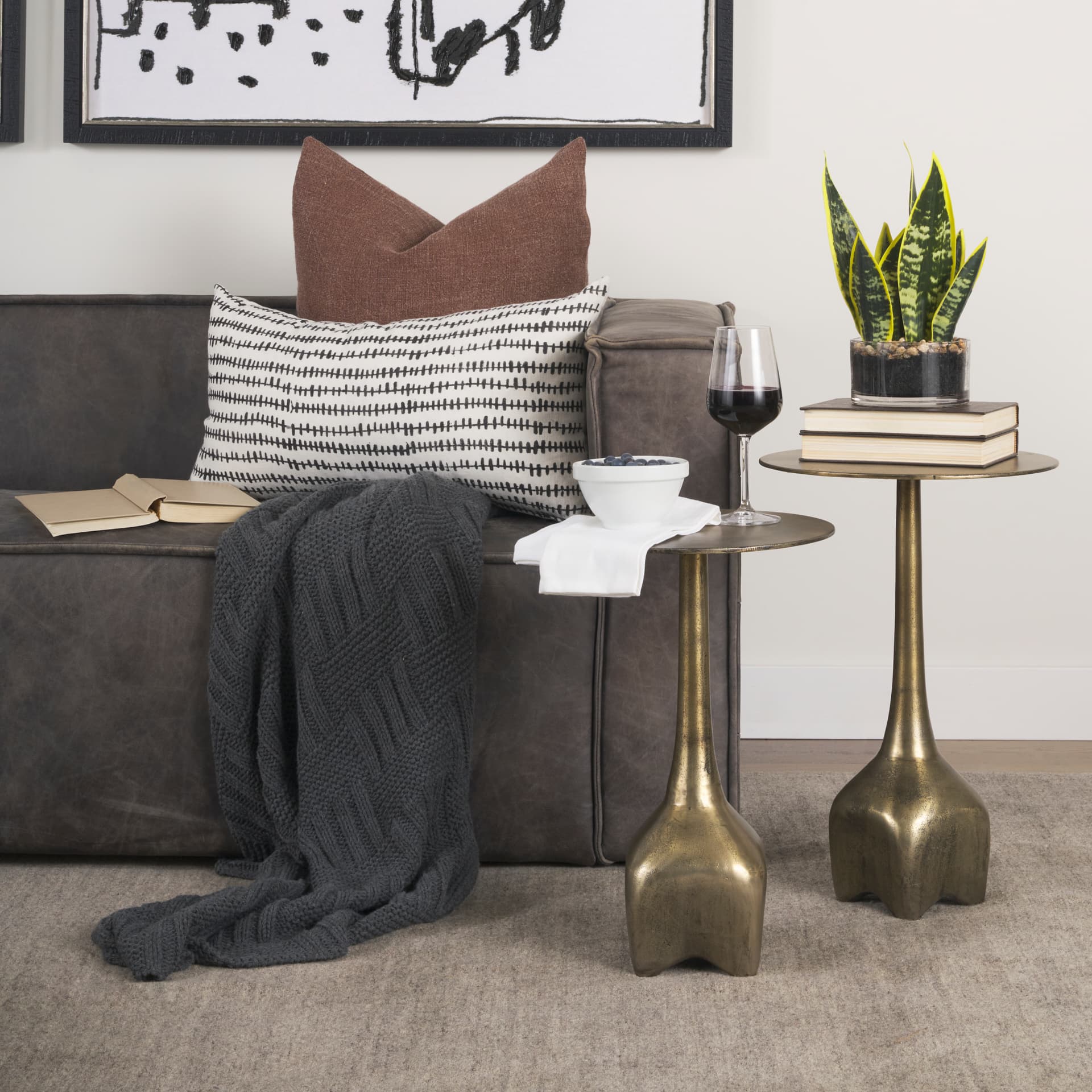 Risha Small Gold Metal Accent Table — in a styled room