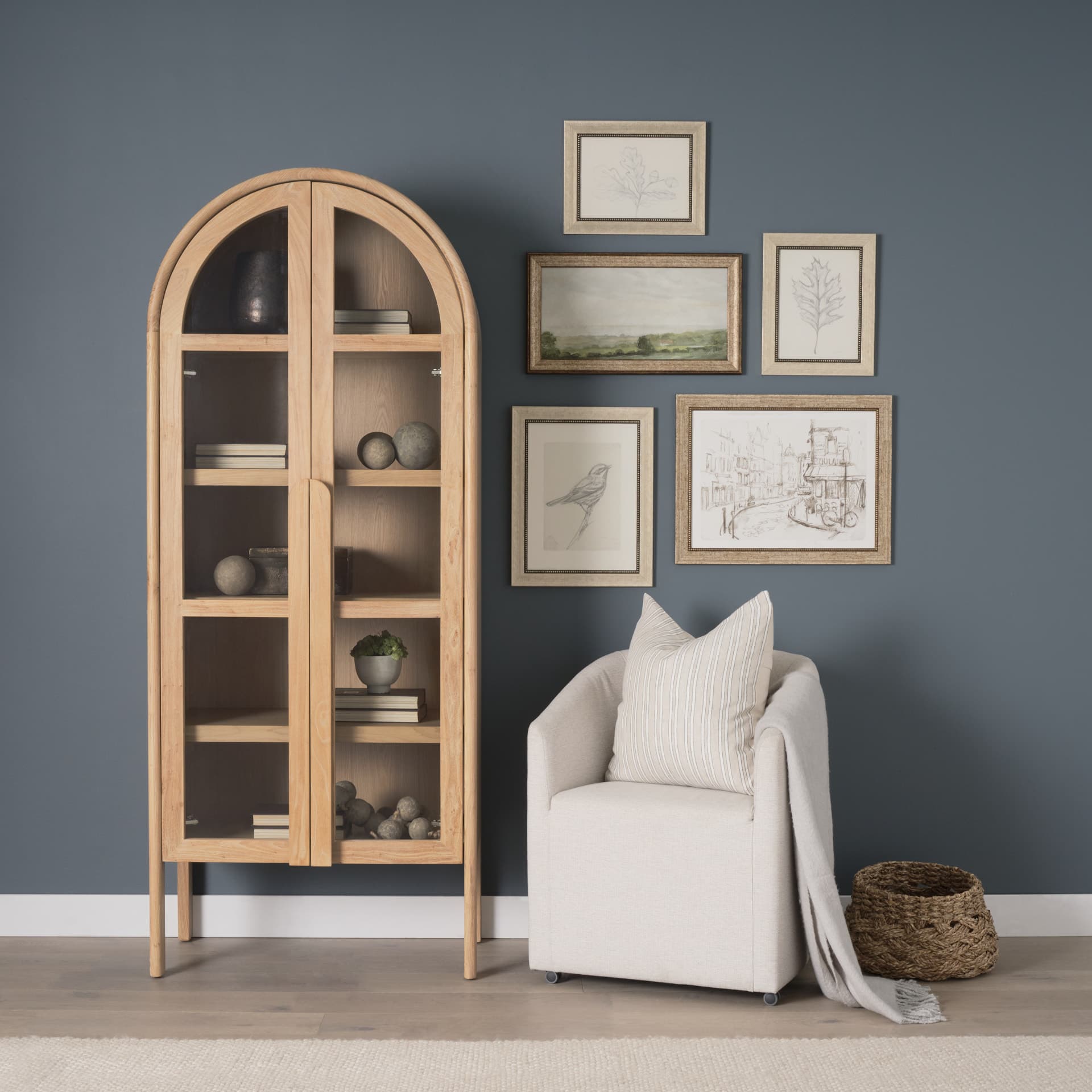 Callum Light Brown Elm Wood w/ Glass Doors Arched Curio Cabinet — in a styled room