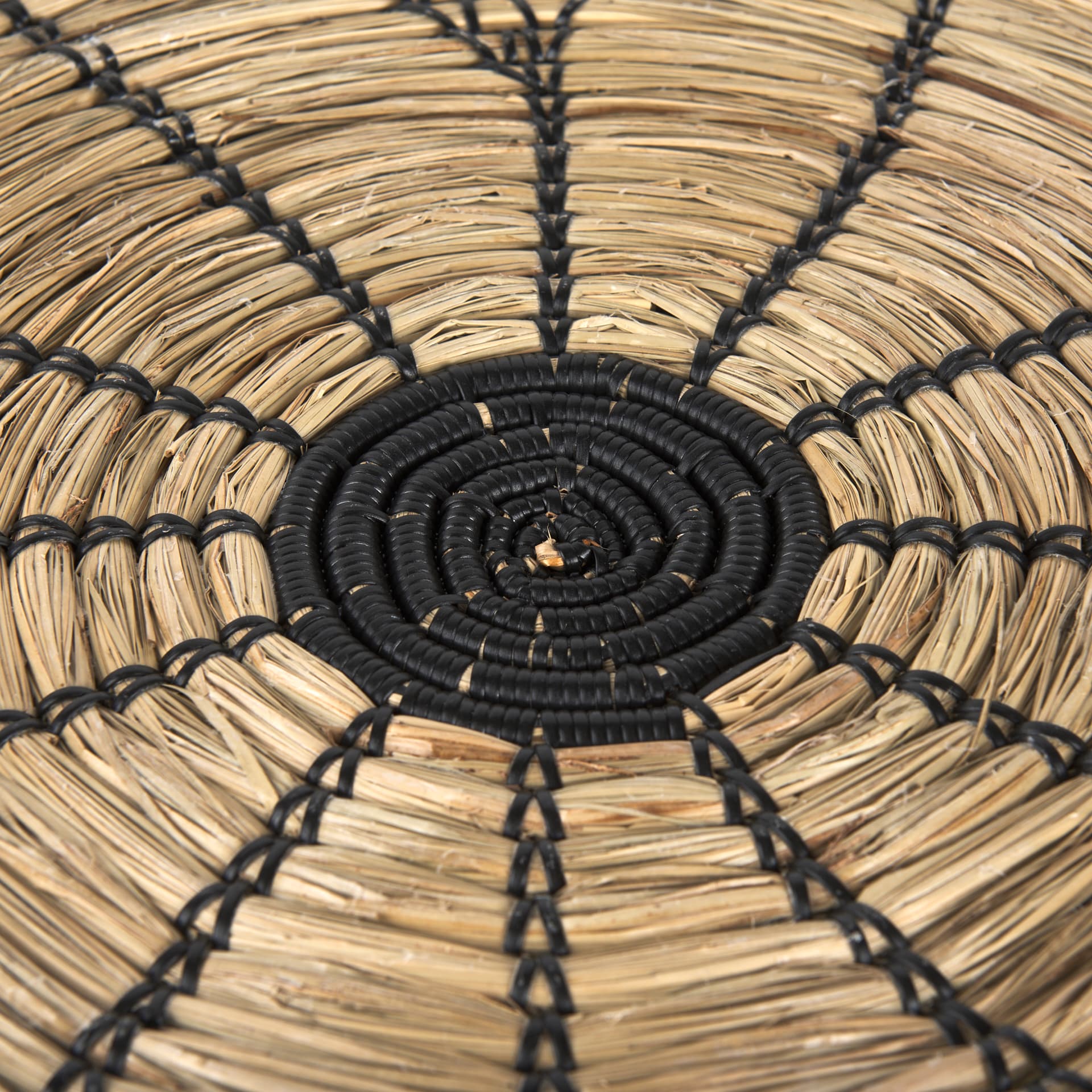 Mekhi 24.0L x 24.0W x 3.5 Light Brown Seagrass W/Black String Round Wall Hanging Plate — product photograph