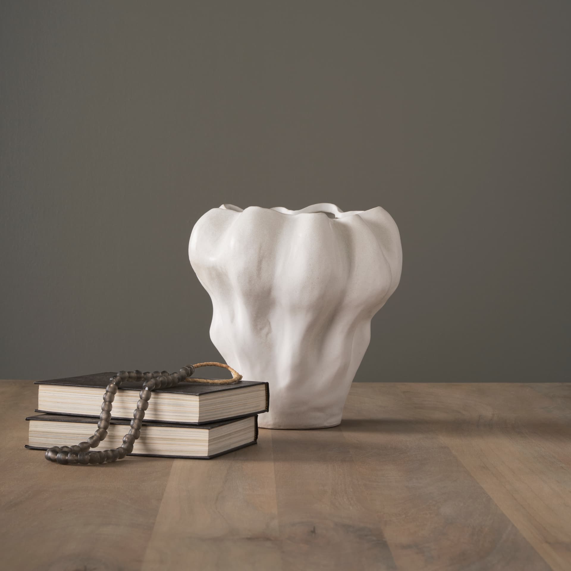 Vanna Sculptural Cream Glazed Ceramic Vase — in a styled room