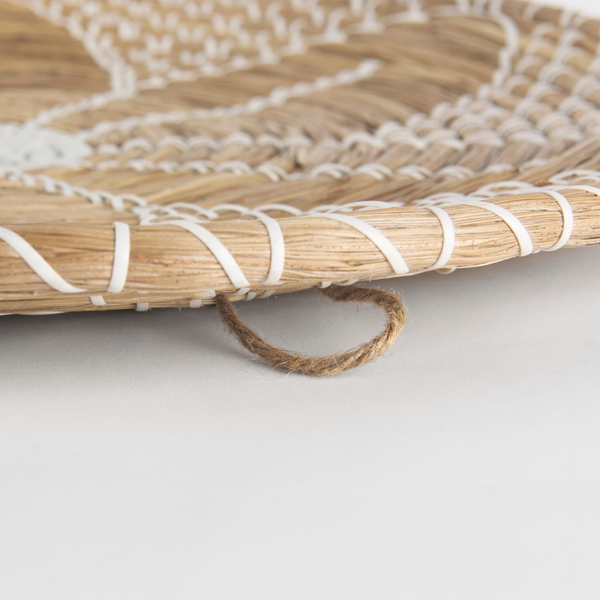 Mekhi 24.0L x 24.0W x 3.5 Light Brown Seagrass W/White String Round Wall Hanging Plate — product photograph