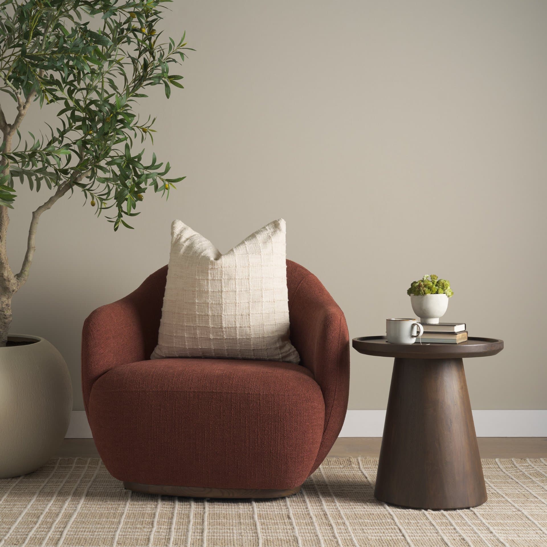 Hudson Burgundy Fabric Upholstered Swivel Chair — in a styled room