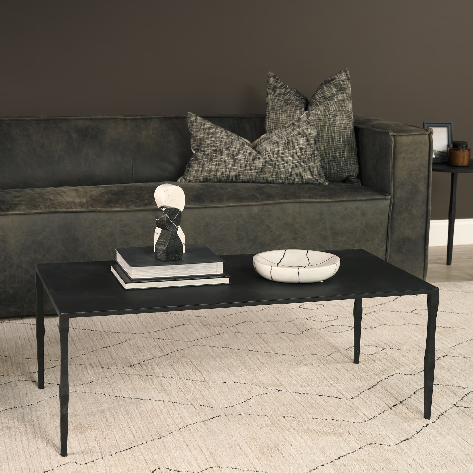 Timothy 42.0 X 22.0 X 15.5 Ebony Black Iron Coffee Table — in a styled room
