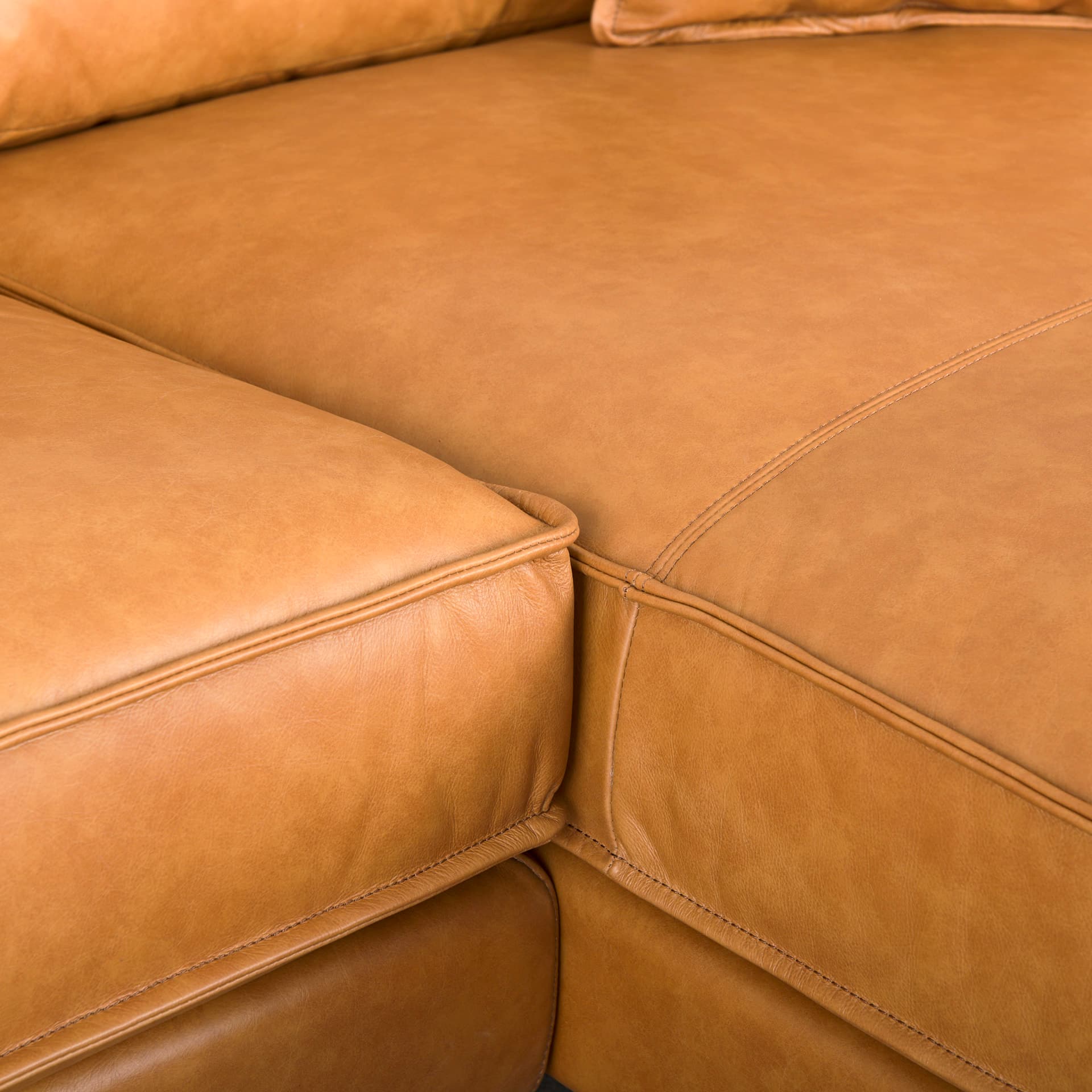 D'Arcy 111"L x 70"D x 33"H Tan Leather Right Chaise Sectional — product photograph