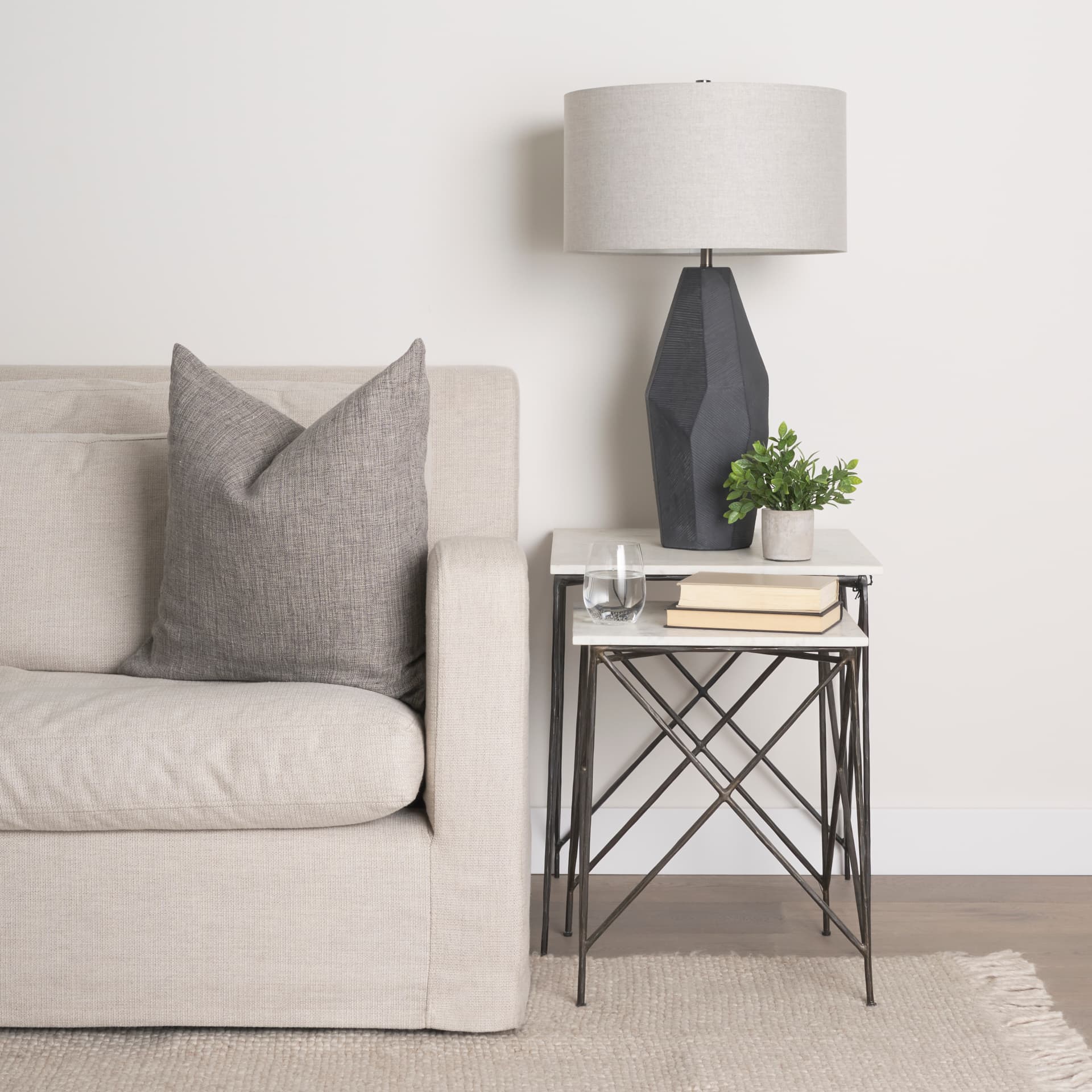 Lorlei 20.0L x 20.0W x 23.8H White Marble Top W/ Gray Iron Legs End and Side Table — in a styled room