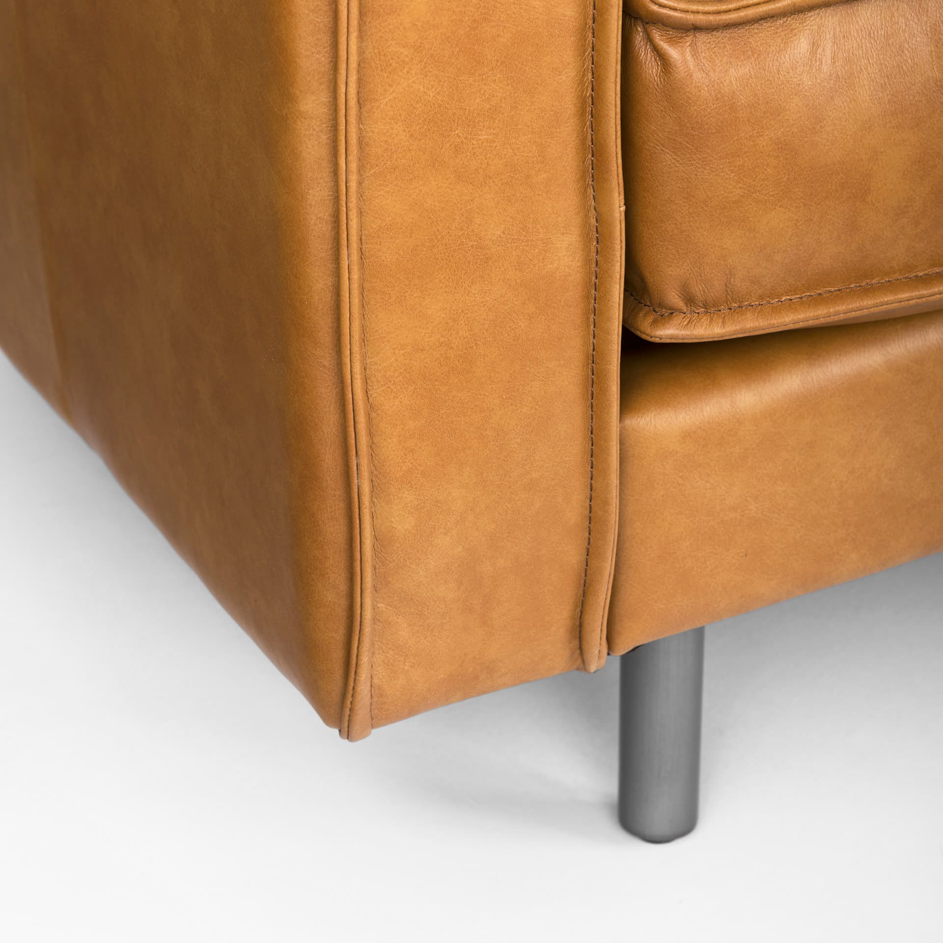 D'Arcy 111"L x 70"D x 33"H Tan Leather Right Chaise Sectional — product photograph