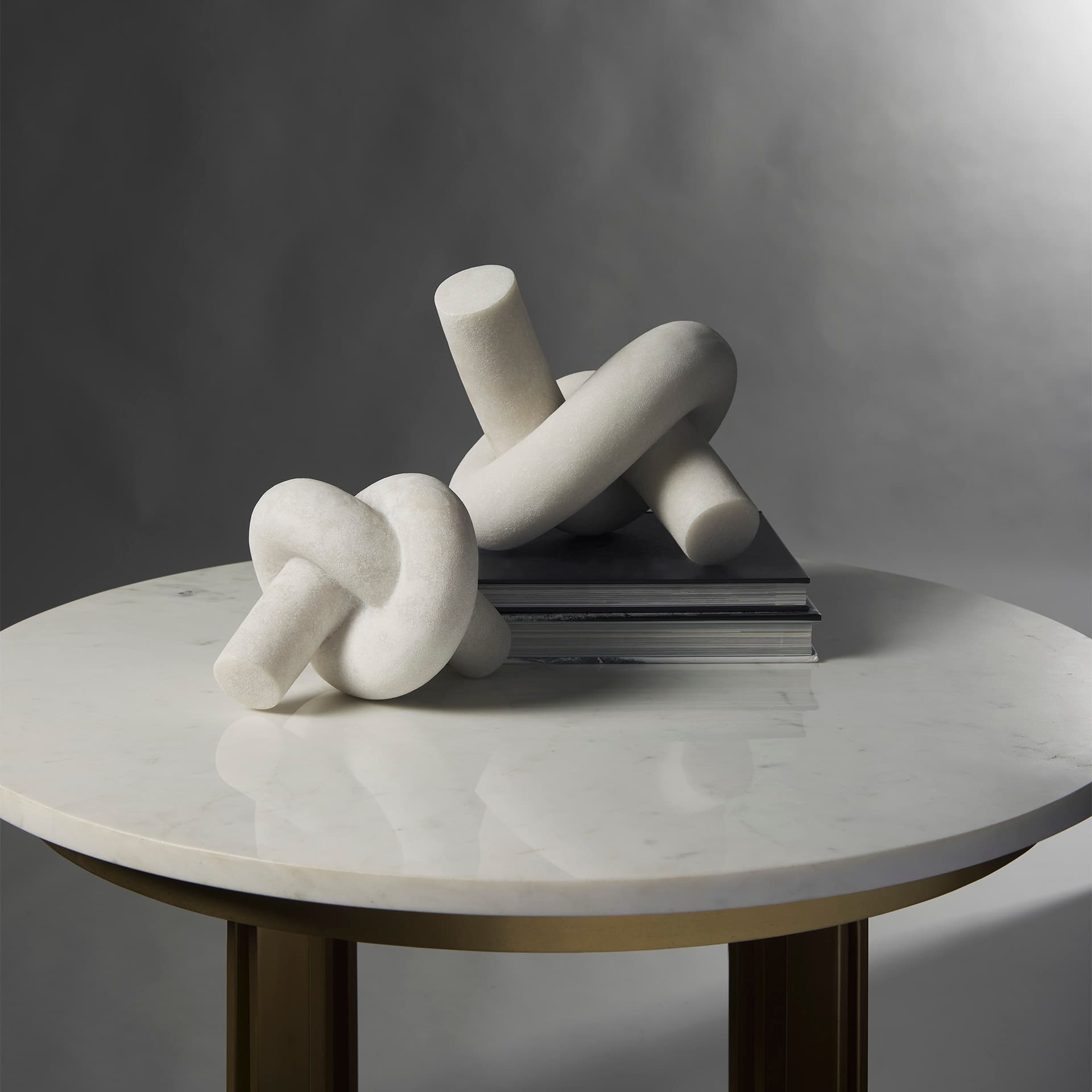 Otto Granite Resin Large Knot Sculpture Decorative Object — in a styled room