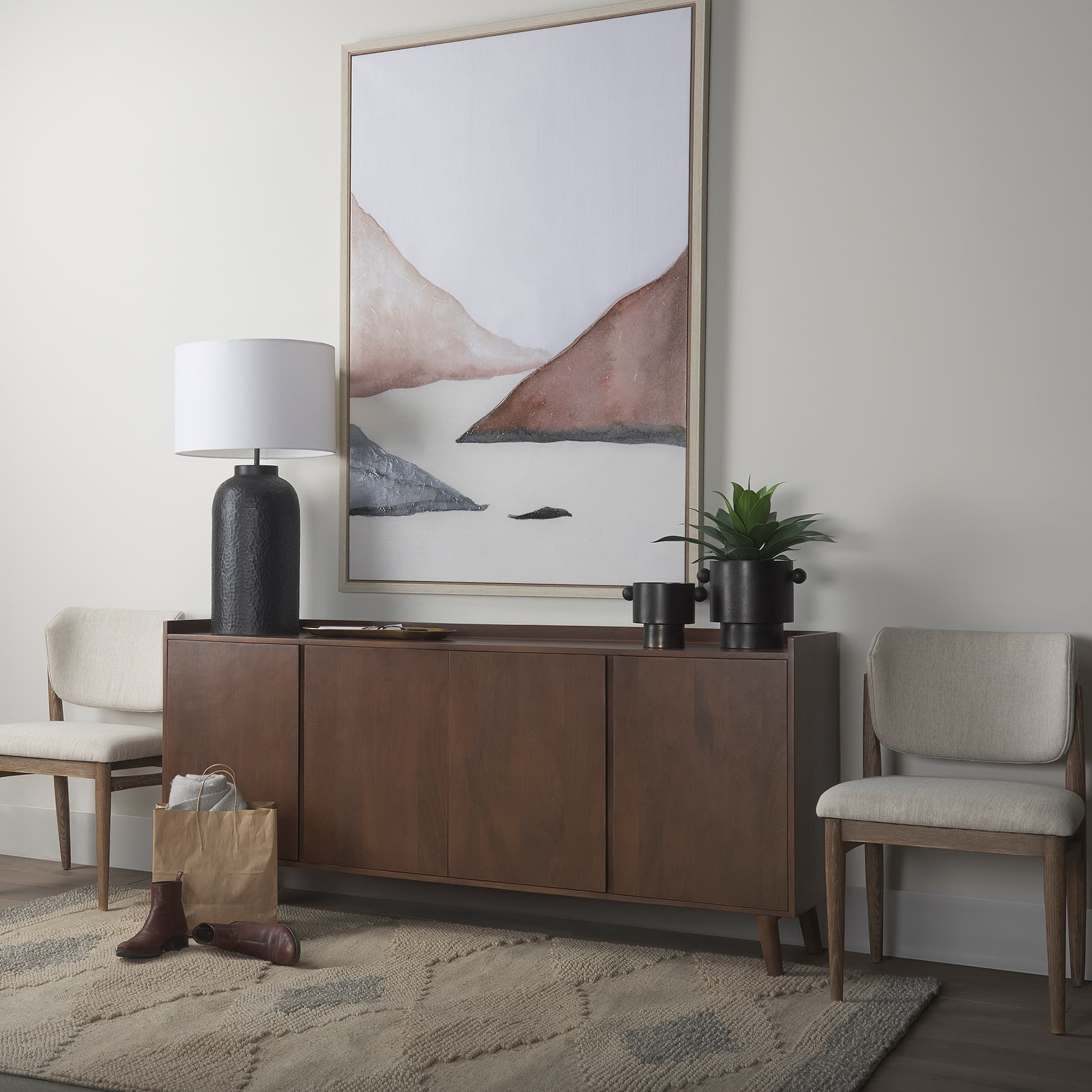 Juno 6.5H Medium Black Iron Vase — in a styled room