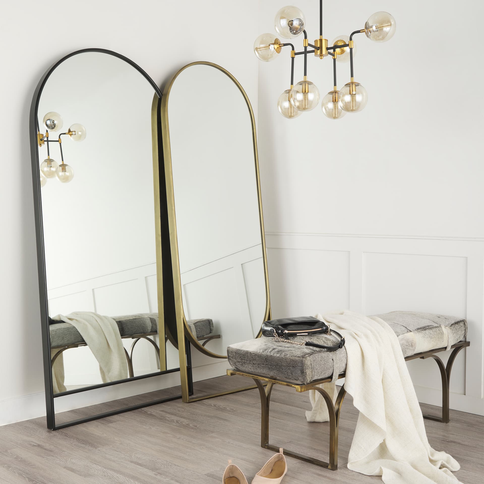 Sadie 36.0L x 2.0W x 76.0H Black Metal Rounded Arch Floor Mirror — in a styled room