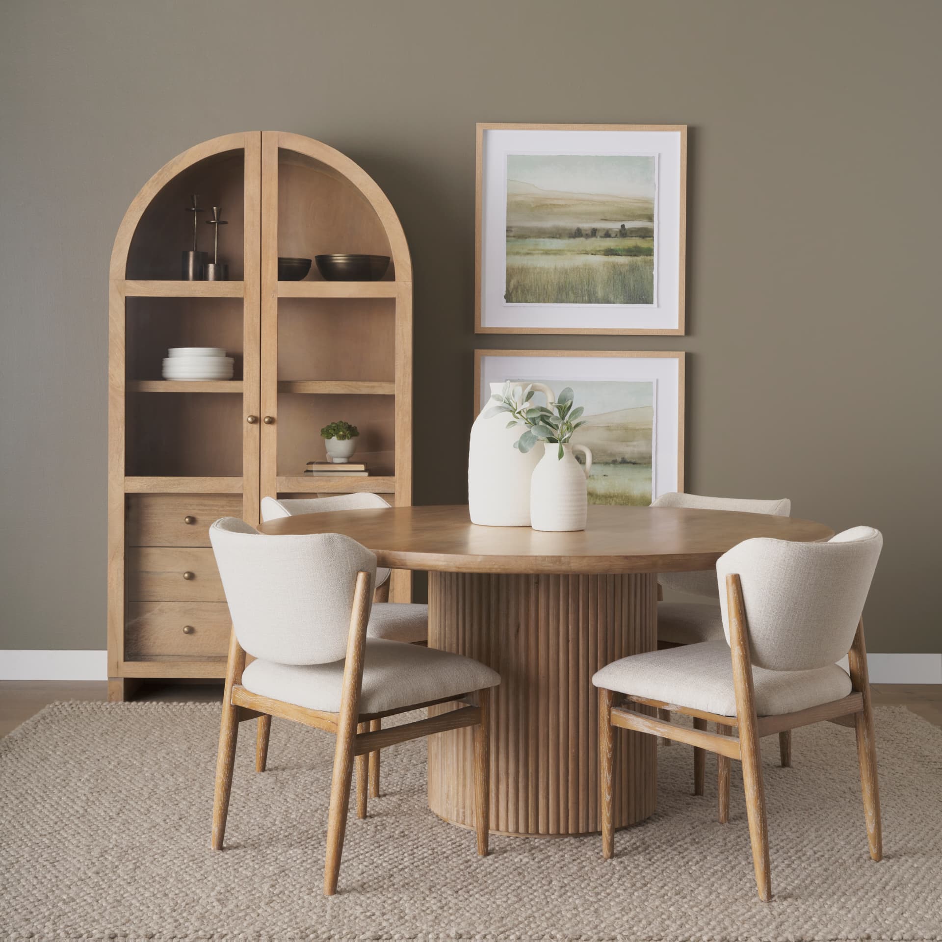 Suri Light Brown Wood W/Glass Doors Arched Curio Cabinet — in a styled room