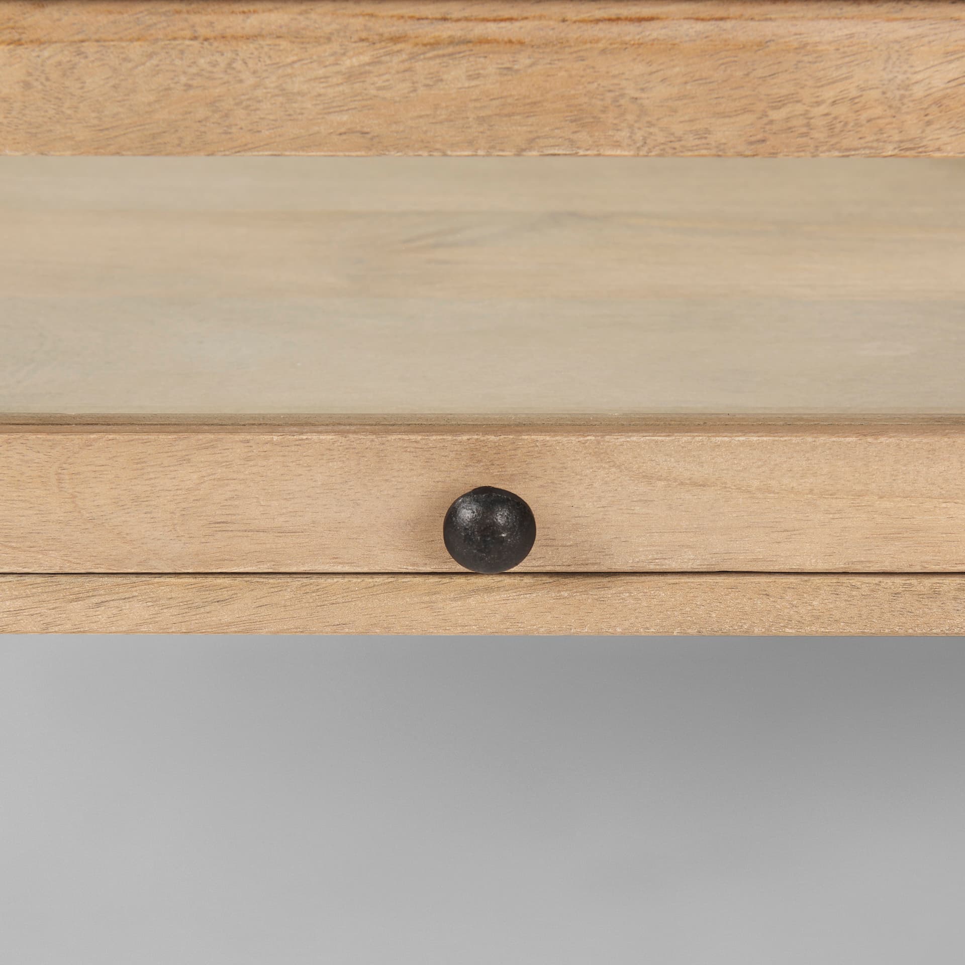 Arelius 49.5"L Rectangular Light Brown Wood w/ Black Metal Base Display Coffee Table — product photograph