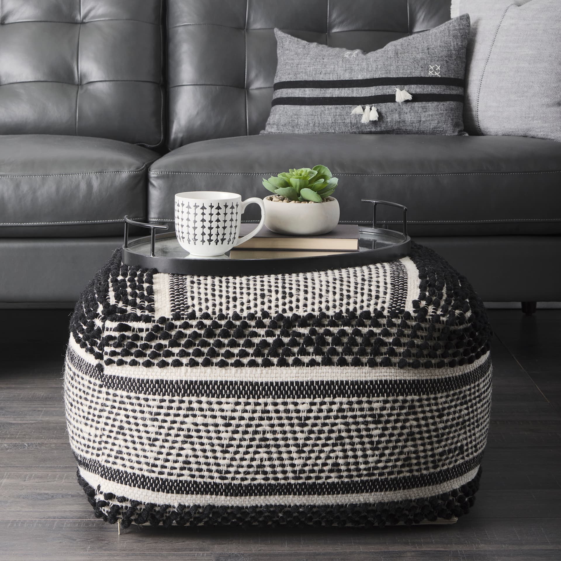 Ansel 20L x 14W Black Metal Mirrored Bottom Oval Serving Tray — in a styled room