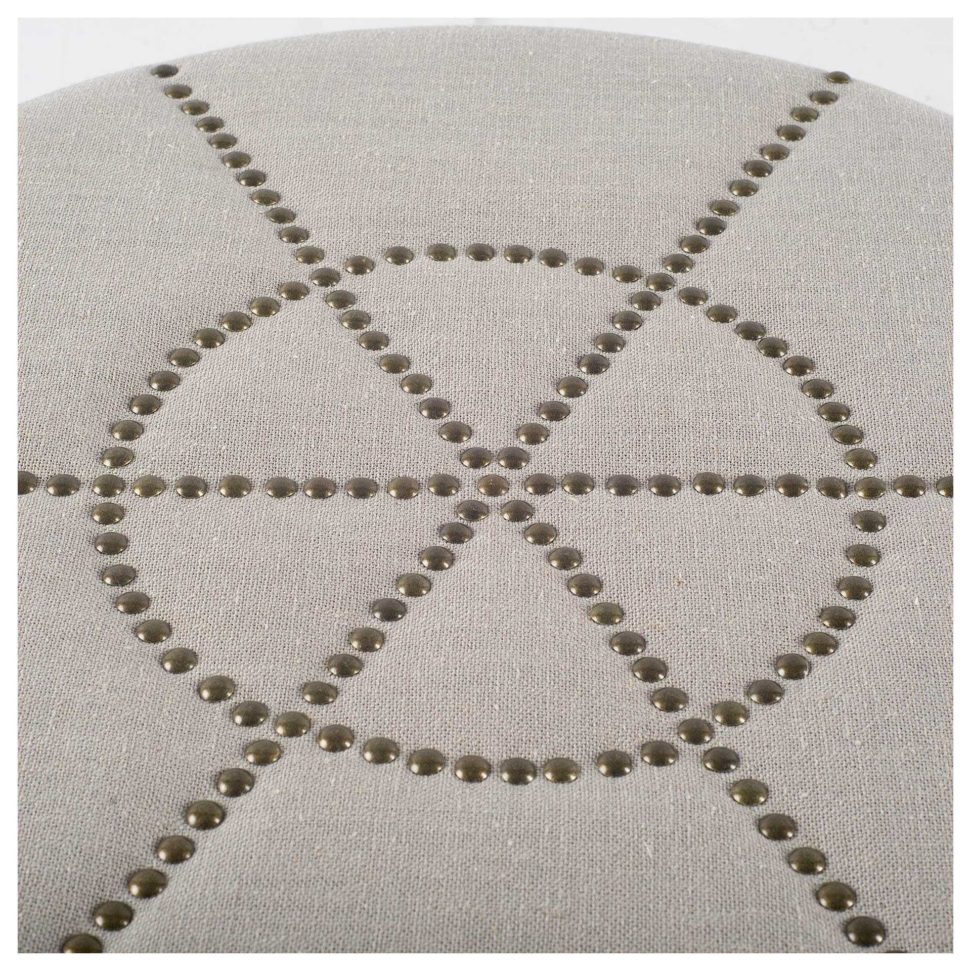 Beacon 20.5"H Cream Fabric w/ Metal Tacks Round Ottoman — product photograph
