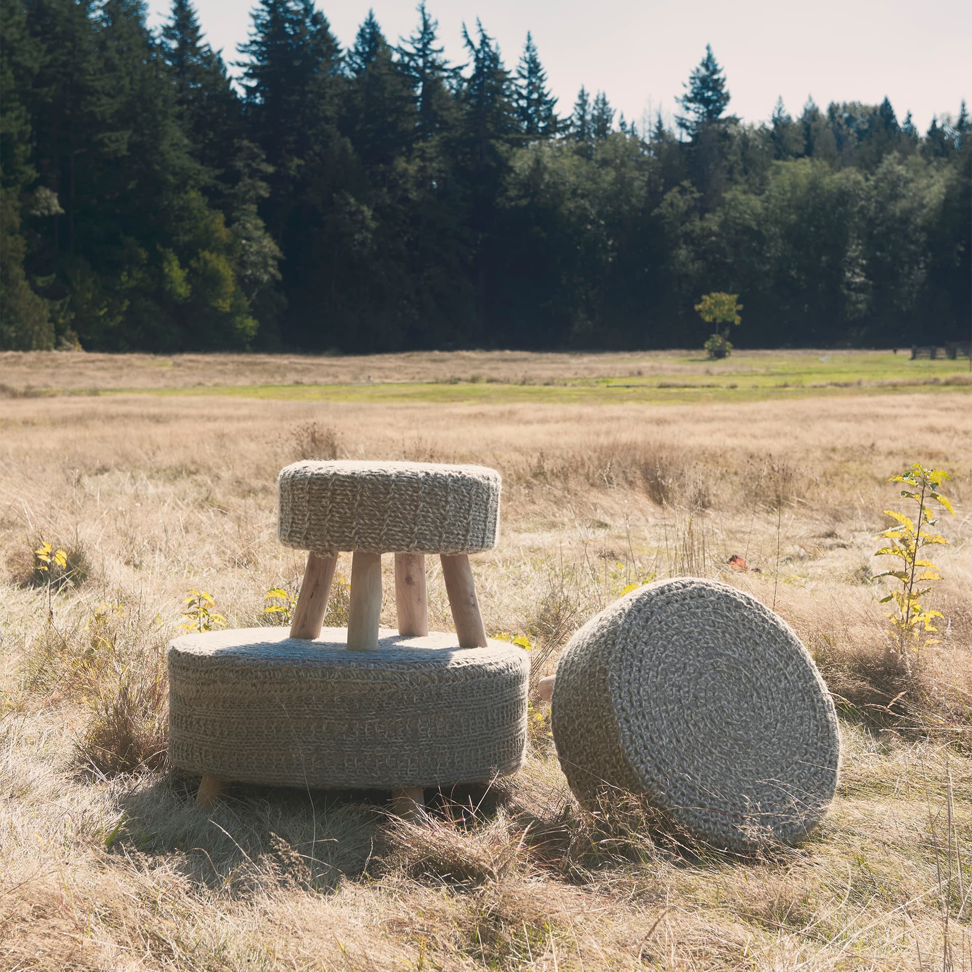 Bina 19.0L x 19.0W x 15.0H Taupe 4 Legged Wool Stool — in a styled room