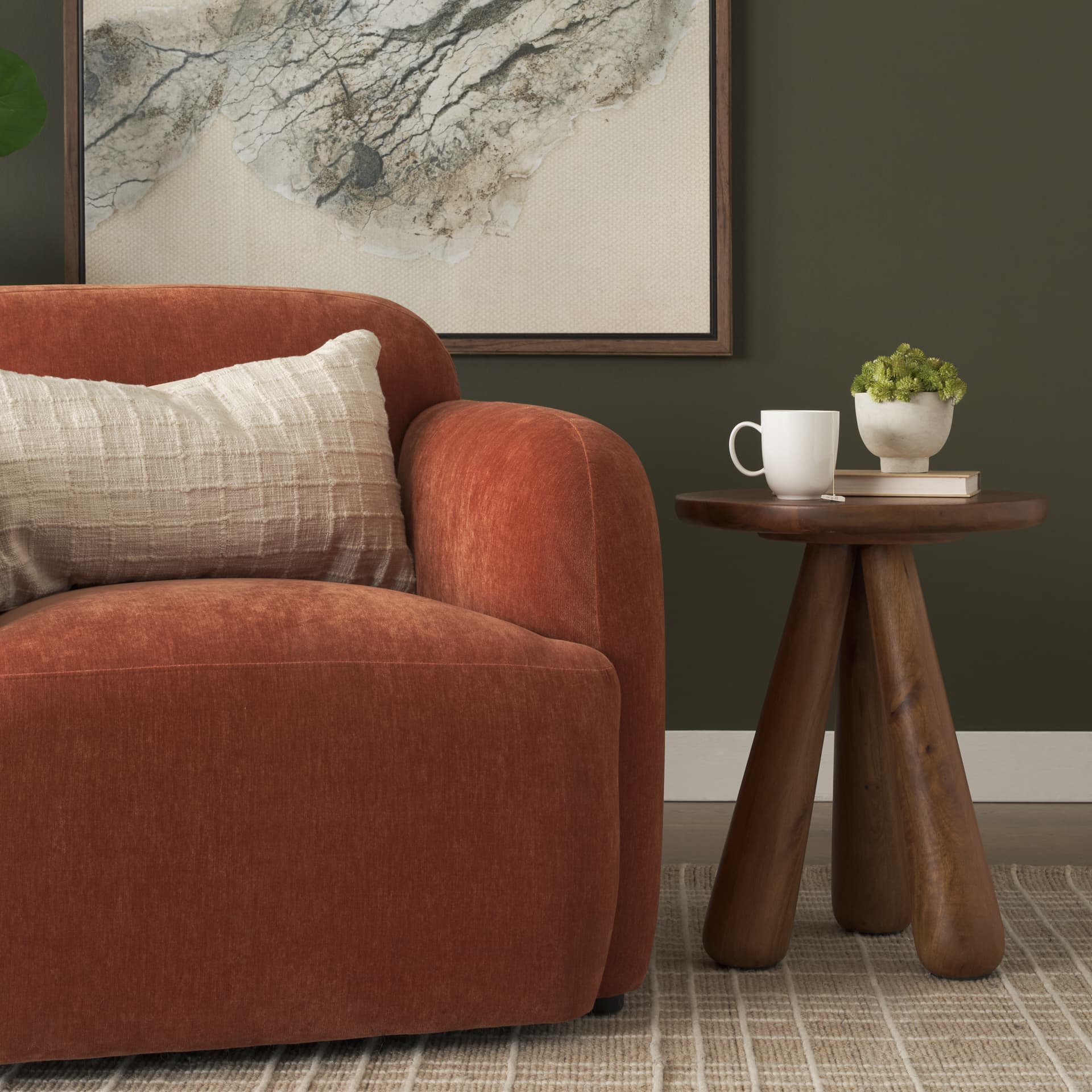 Mora Medium Brown Wood 3-Legged Accent Table — in a styled room