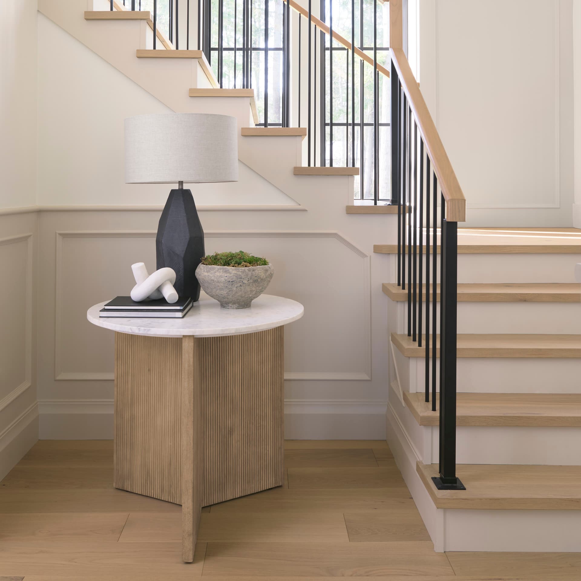 Enzo Marble Tabletop w/ Fluted Light Wood Base Foyer Accent Table — in a styled room