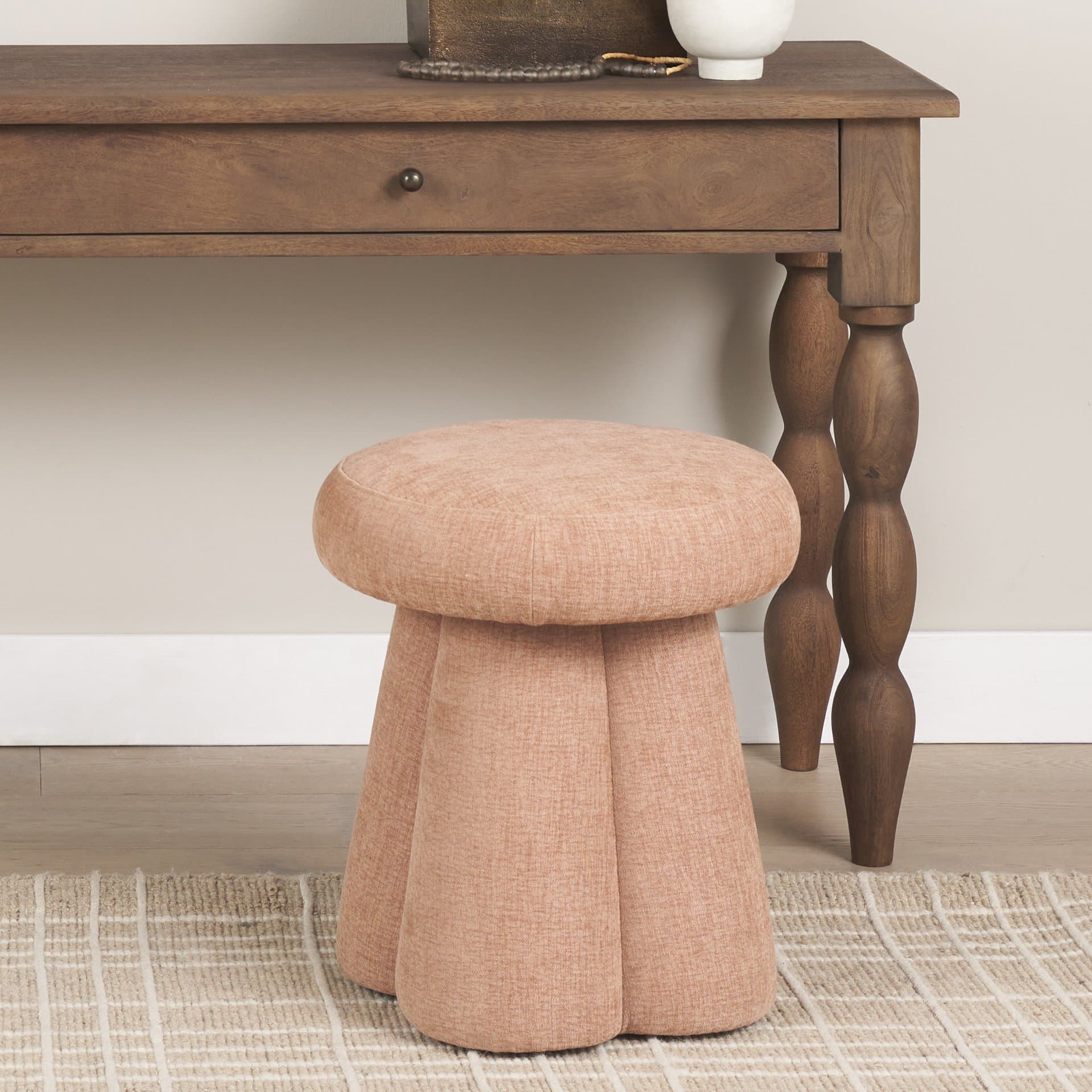 Oona Upholstered Ottoman | Sienna Fabric | 3 Legs — in a styled room