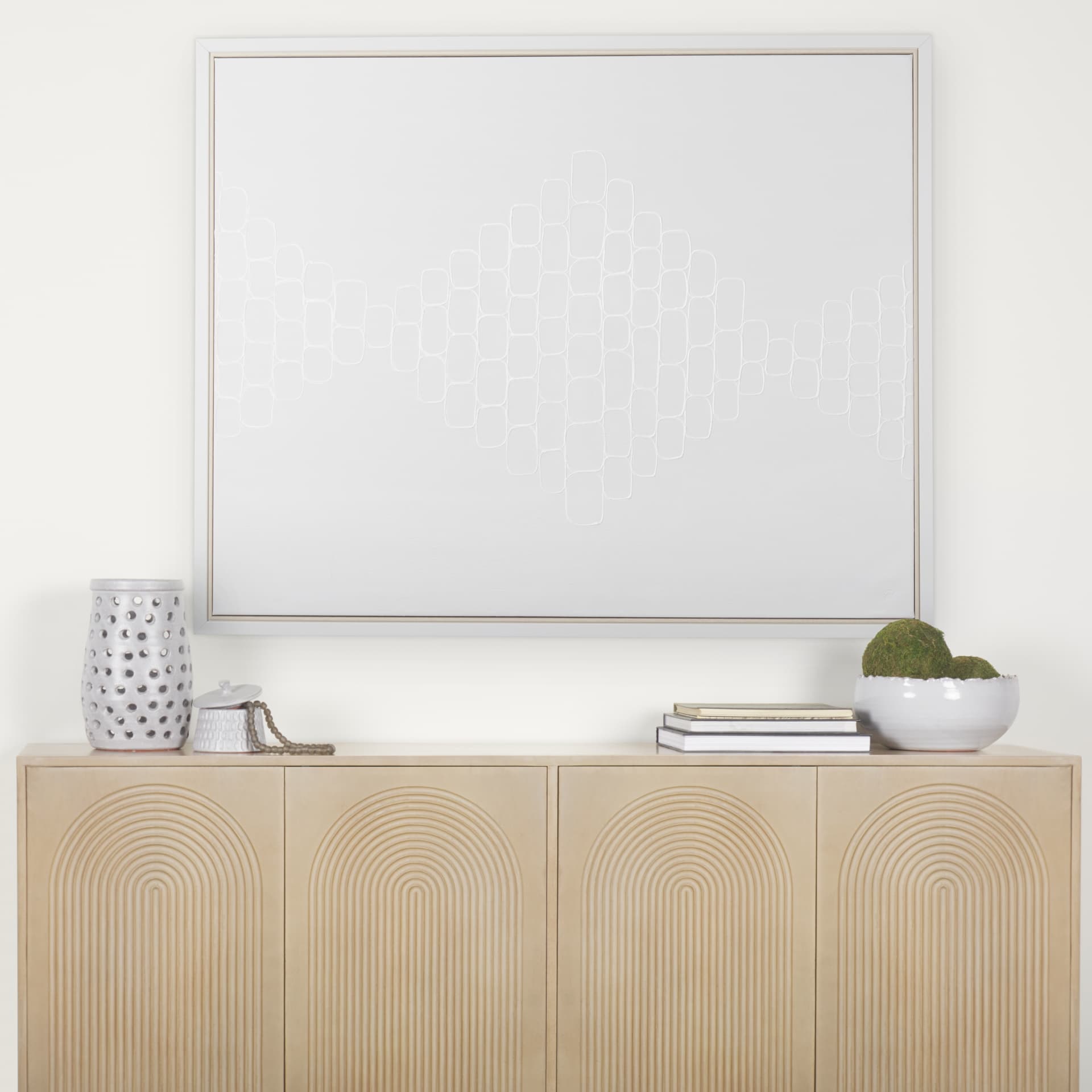 Tucker Light Brown Wood w/ Carved Arch Pattern 4 Door Sideboard — in a styled room