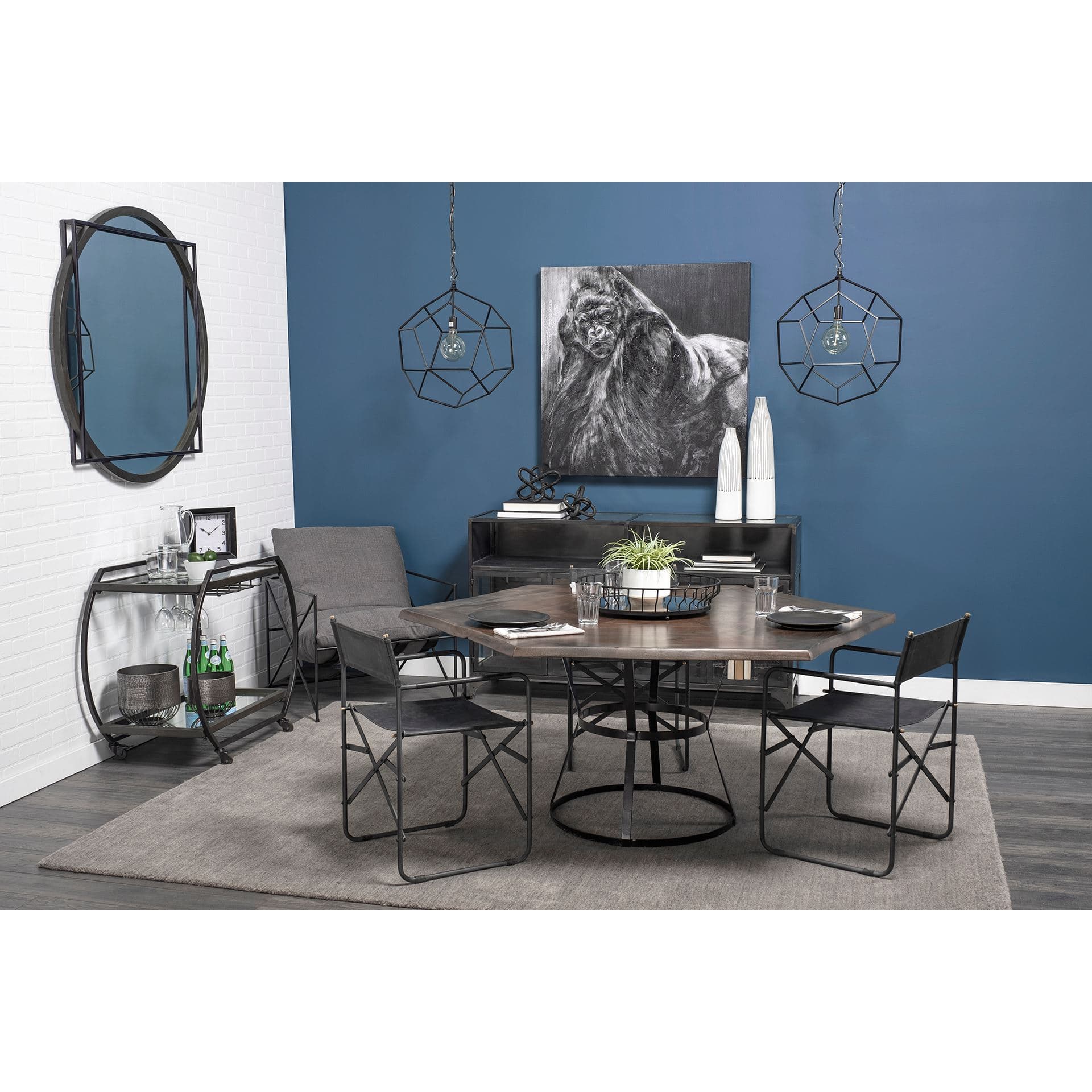 Chriselle Black Metal And Glass Two Tier Bar Cart — in a styled room