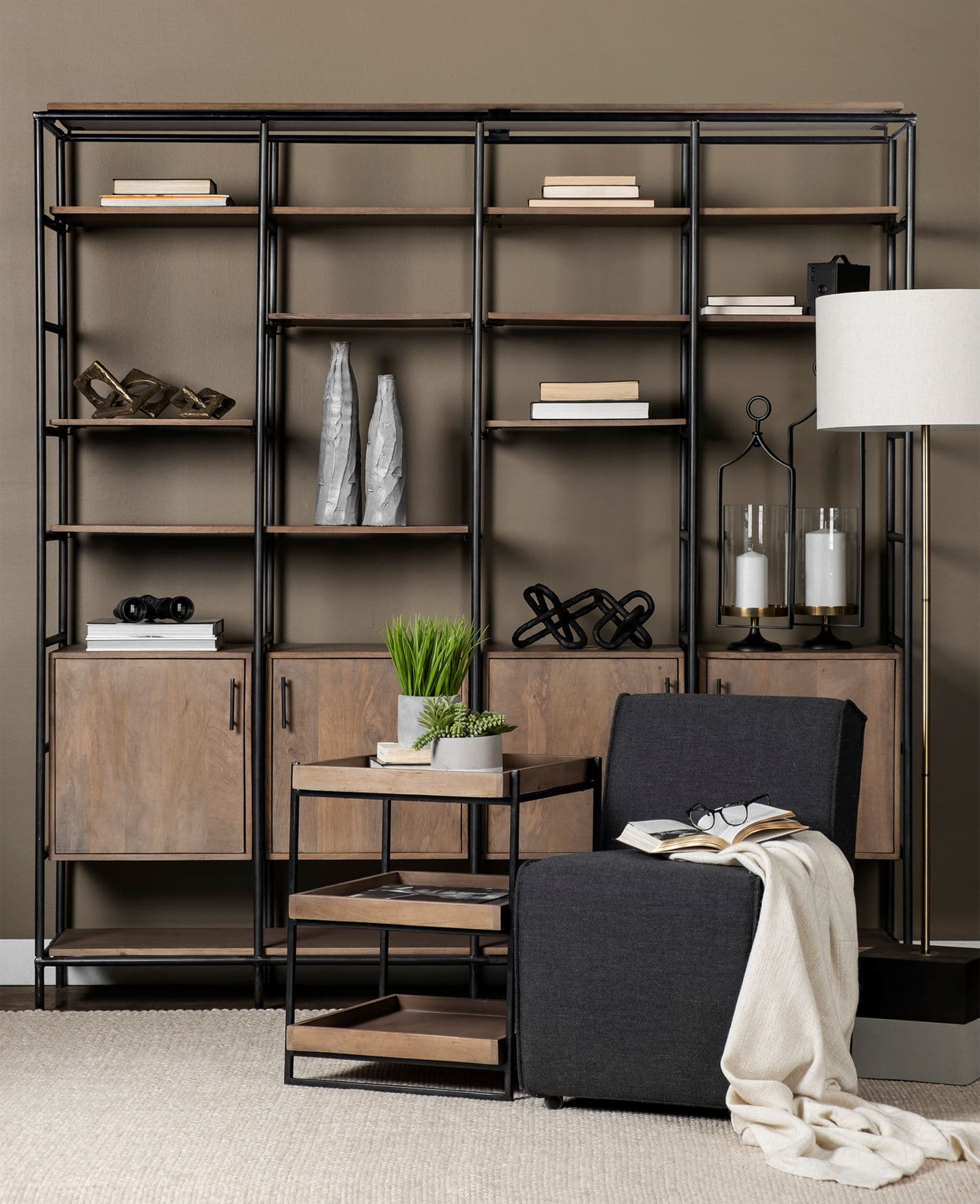 Darius 82L x 16.5W x 90H Medium Brown Wood and Metal Multi-Shelf Shelving Unit — in a styled room