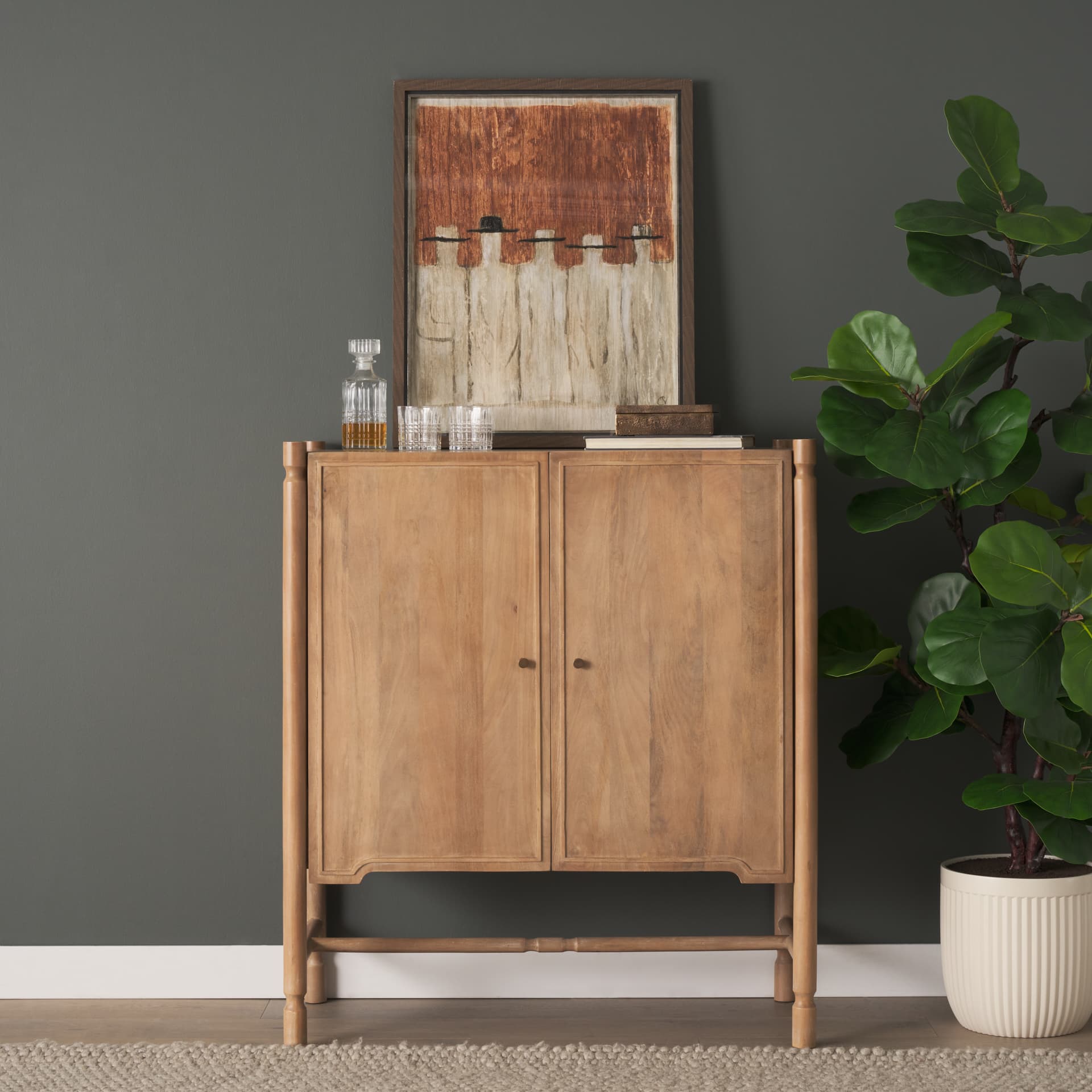 Phil Light Brown Wood 2 Door Bar Cabinet — in a styled room