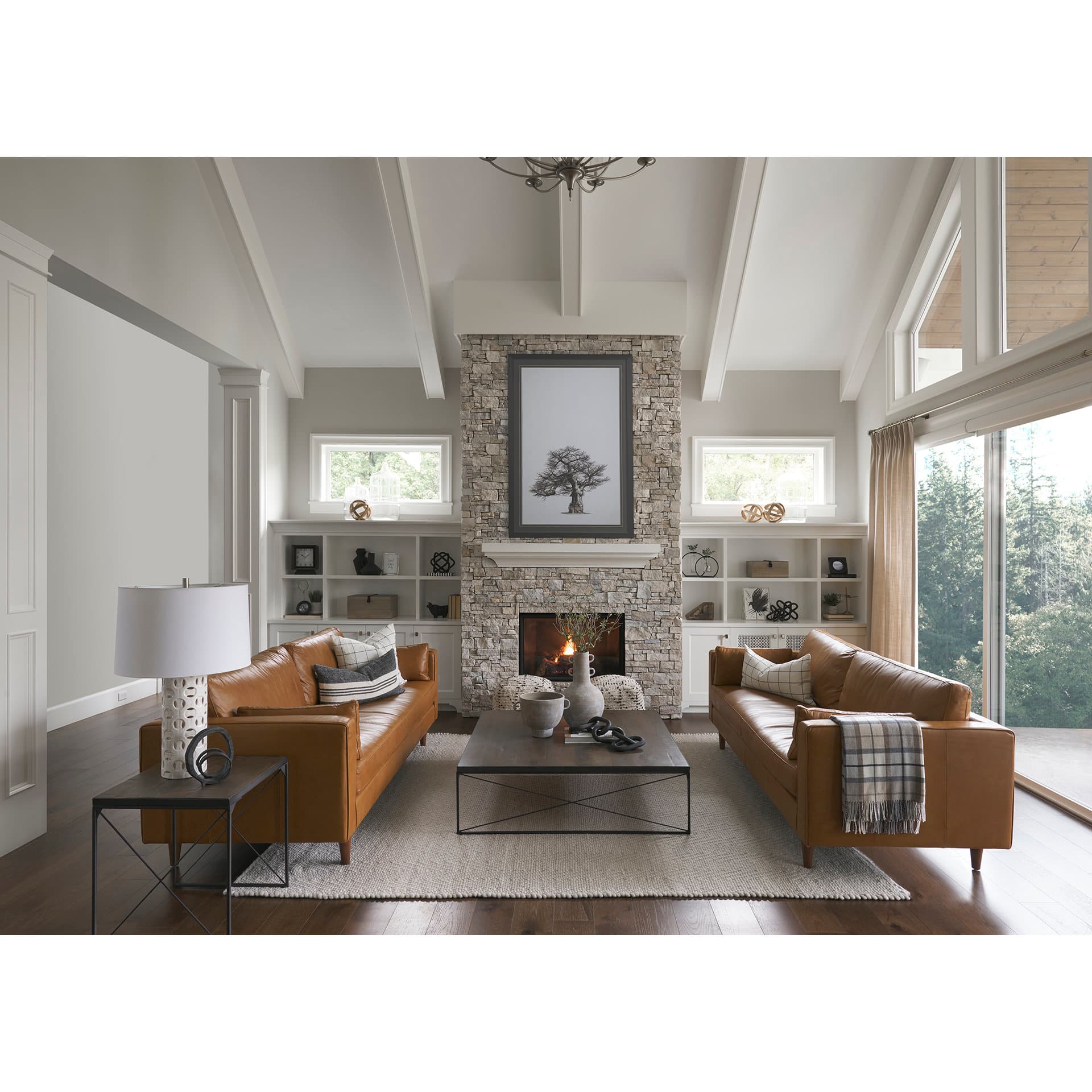 Elton 87.8L x 37.8W x 34.6H Tan Leather Sofa — in a styled room