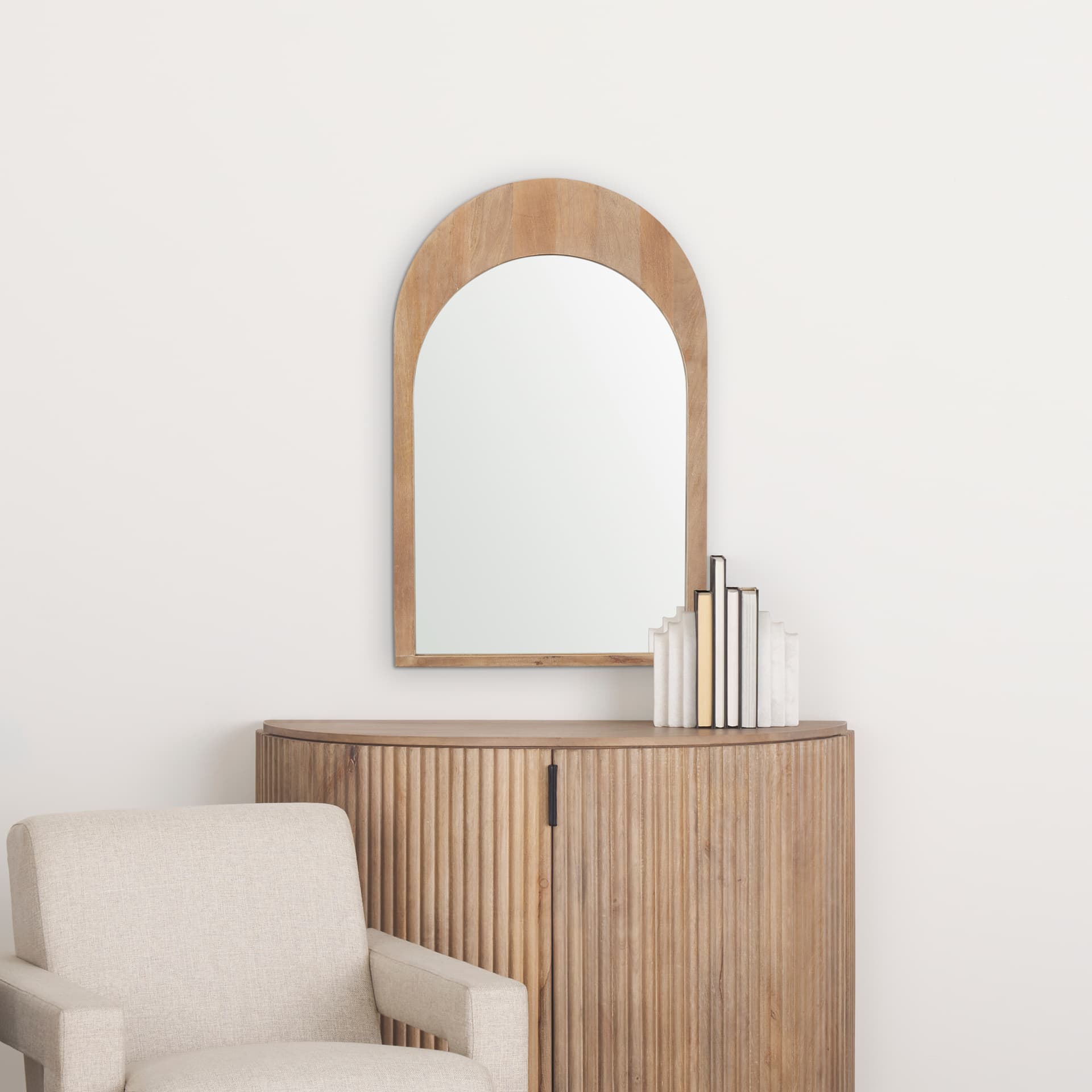 Celeste Light Brown Wood Arched Mirror — in a styled room
