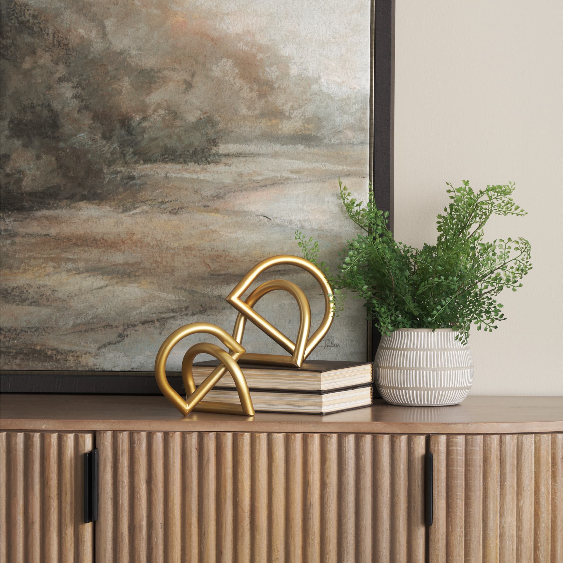 Locke Large Gold Metal Decorative Object — in a styled room